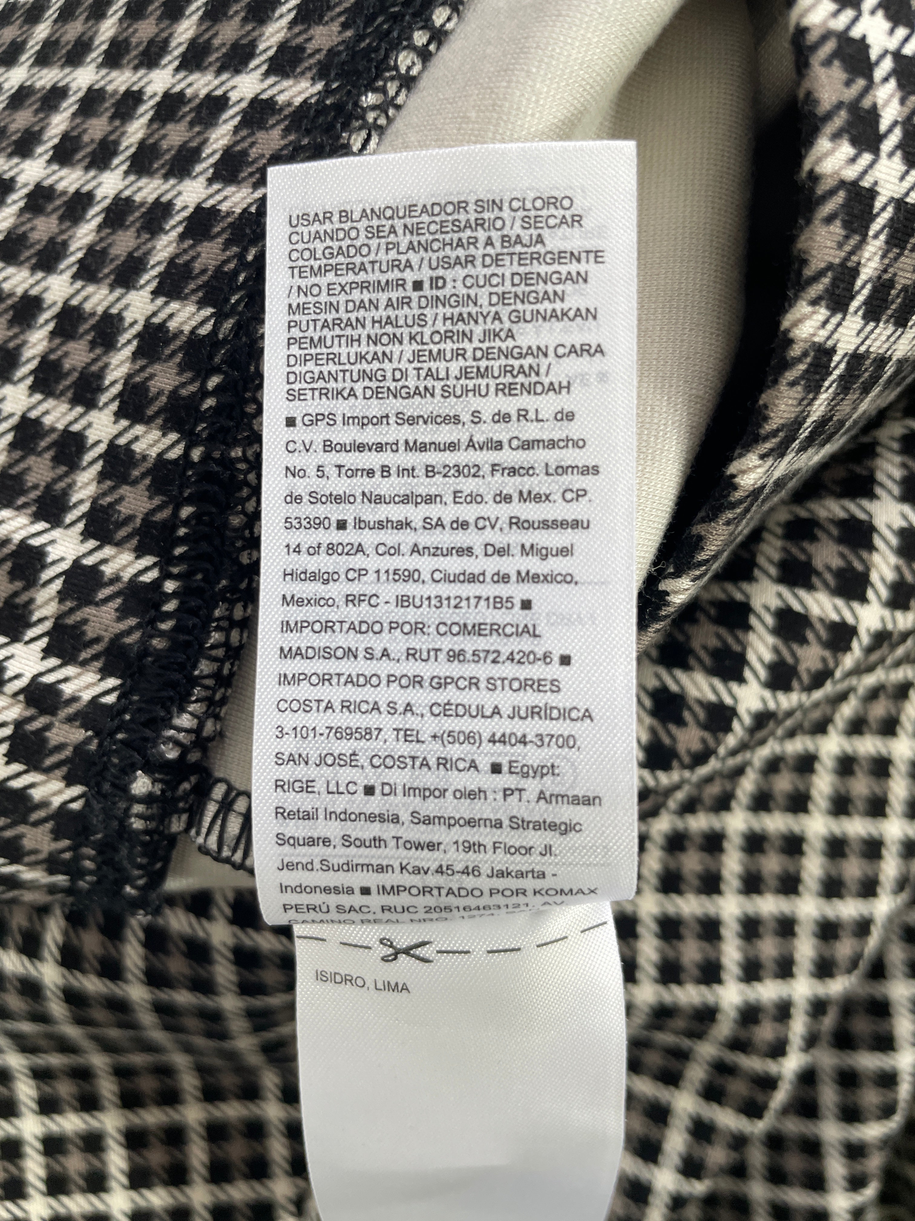 1. Old Navy Stevie black white houndstooth pants manufacturer and garment care label