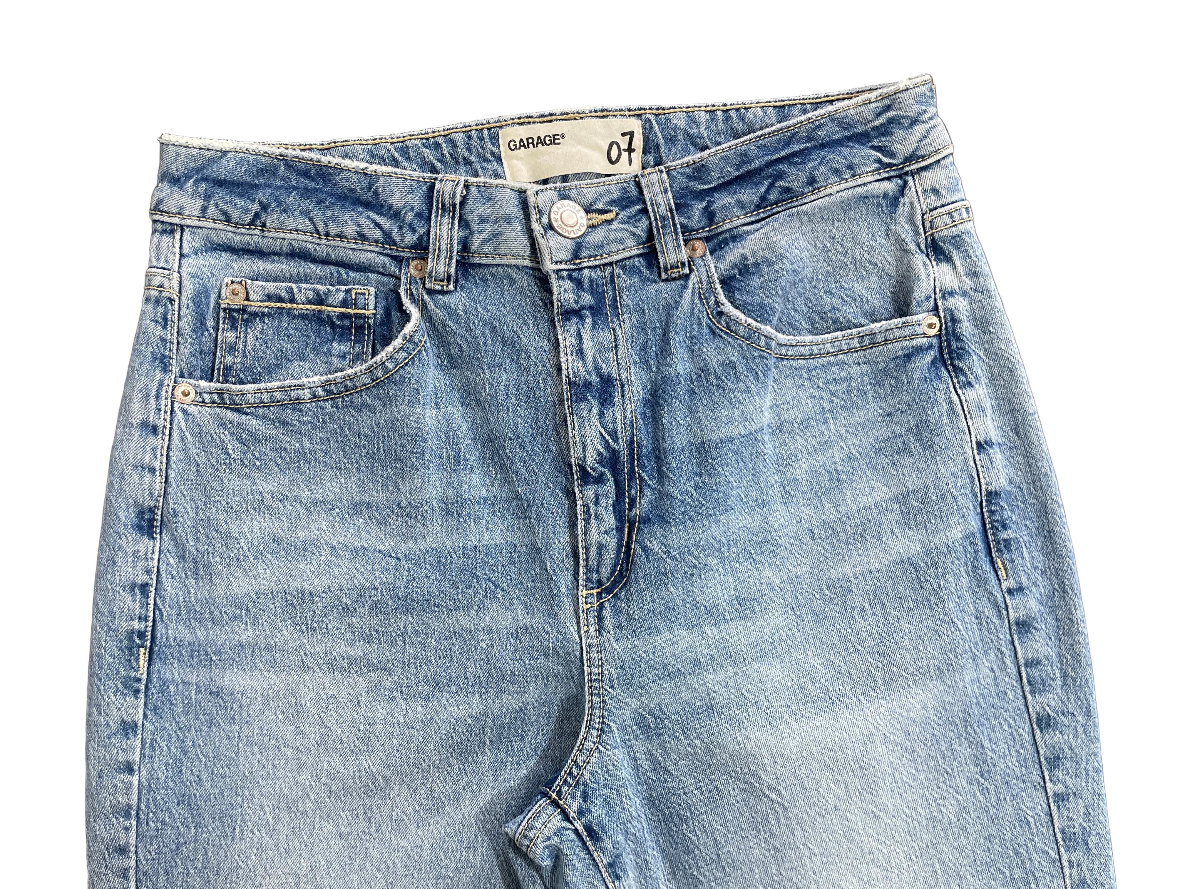 Size 7 Garage light wash blue high rise jeans front waistband button and five pocket detail