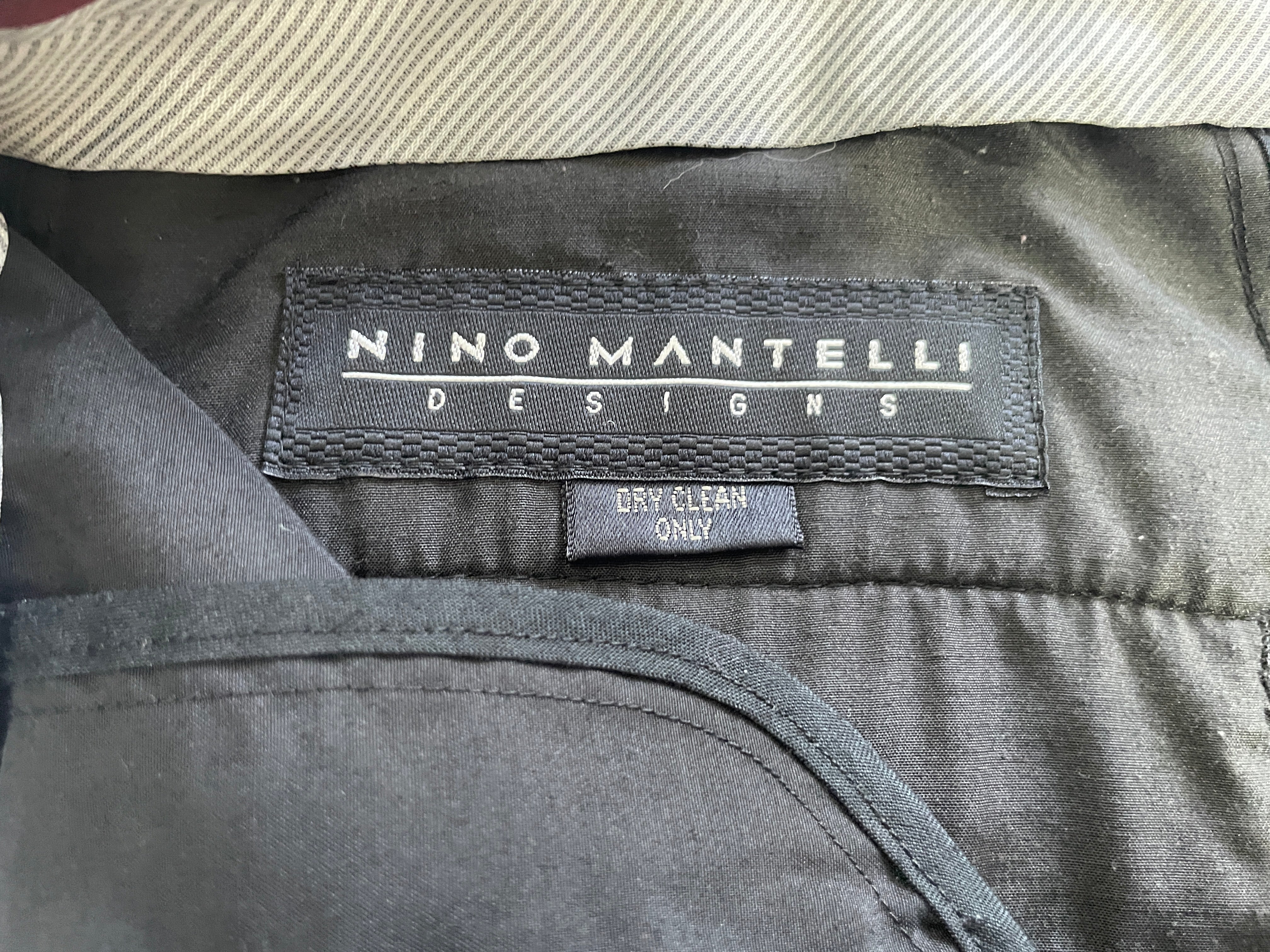 Nino Mantelli men's black and grey striped dress pants back view with buttoned welt pocket