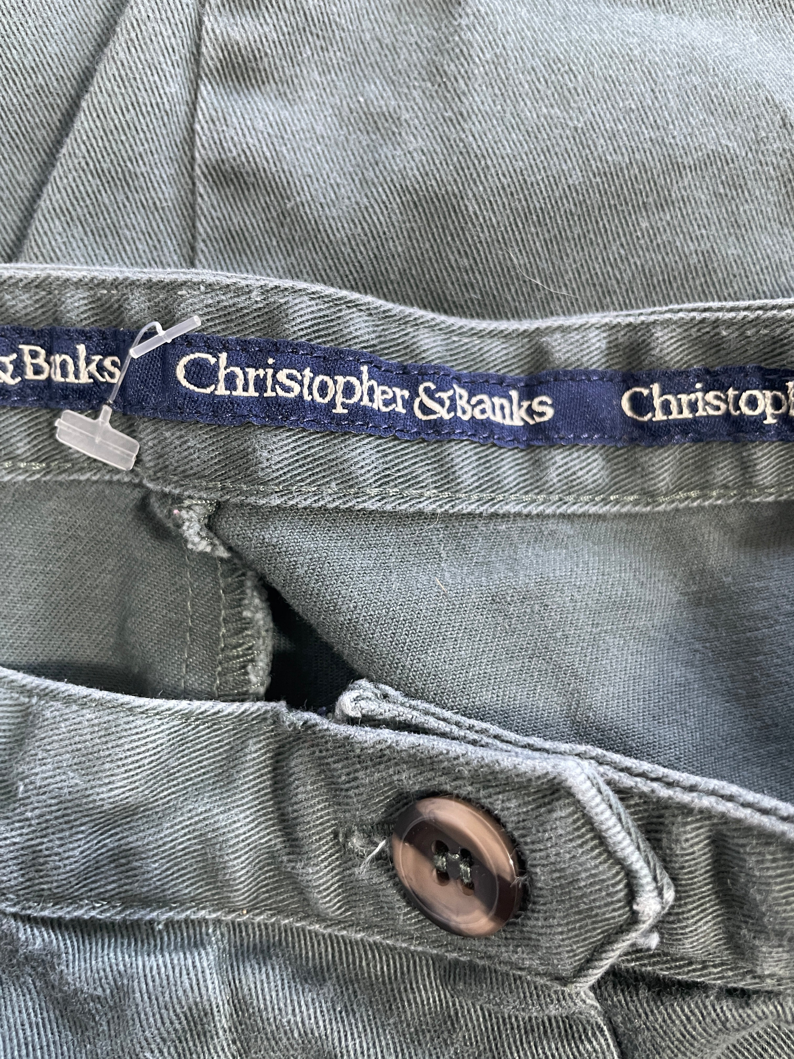 Christopher & Banks woven brand label and button detail on sage green skirt