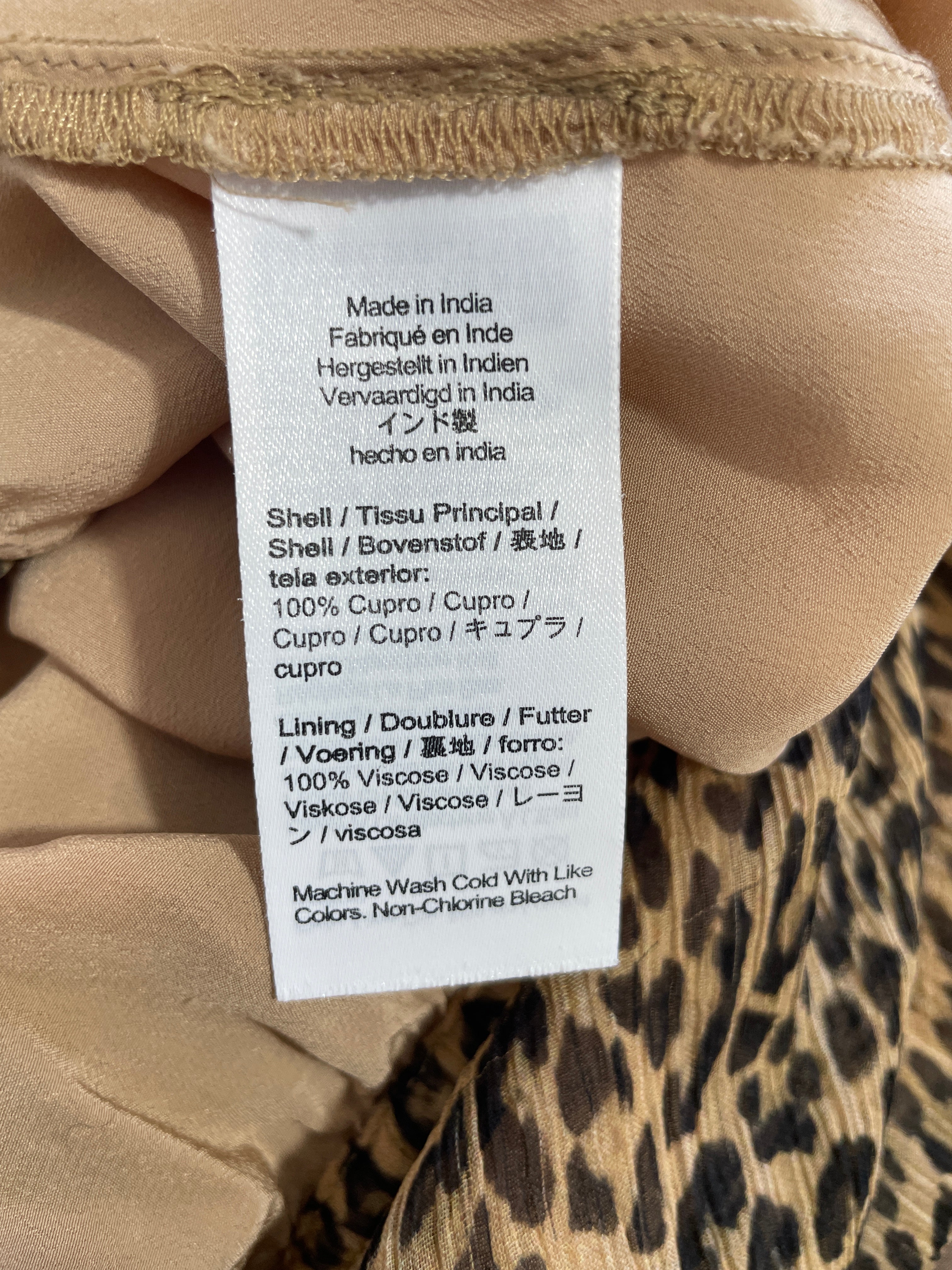 J.Crew leopard print skirt fabric composition label showing 100% cupro shell and 100% viscose lining