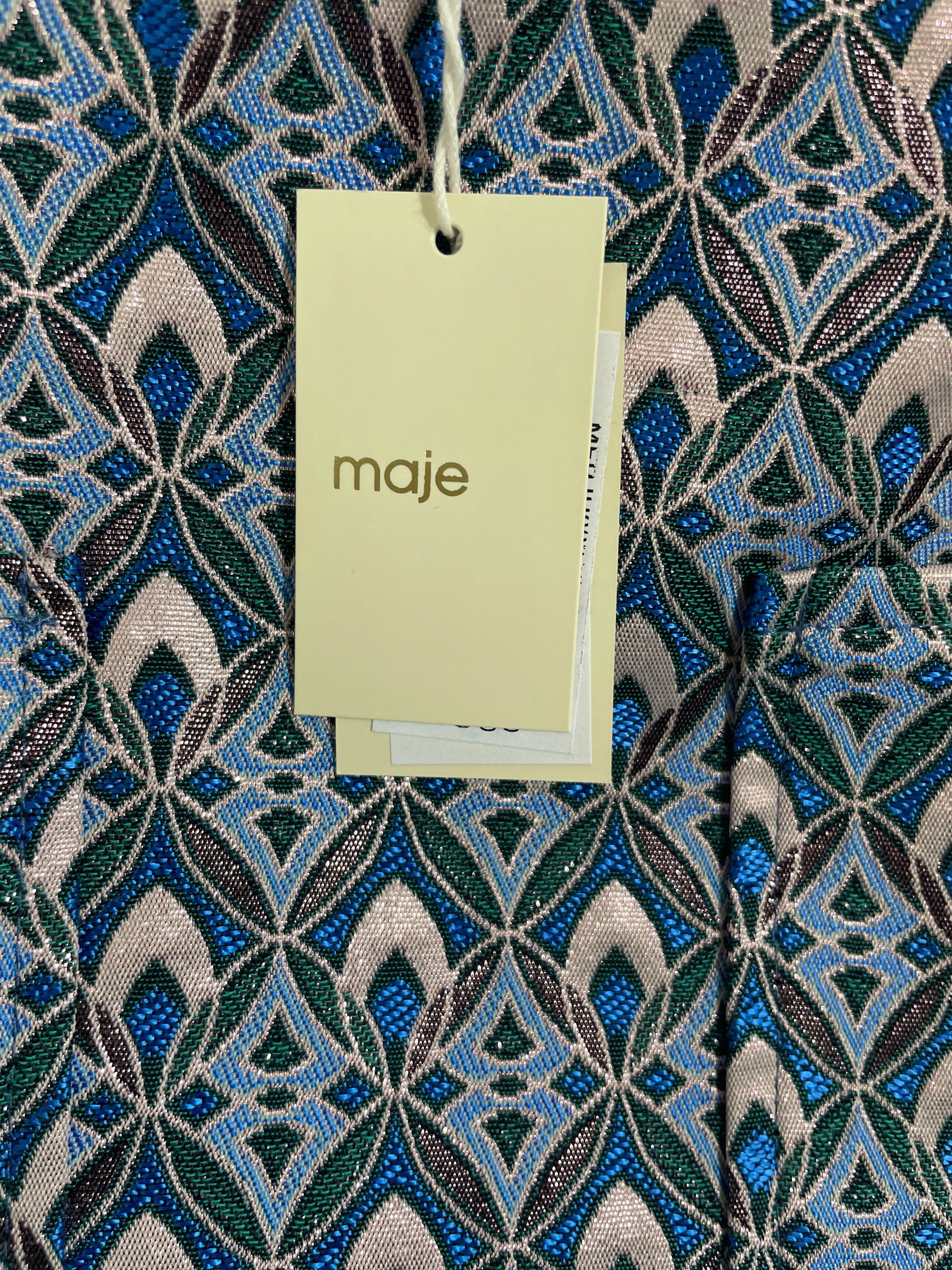 Detailed geometric pattern and horizontal seam on Maje designer jacquard skirt