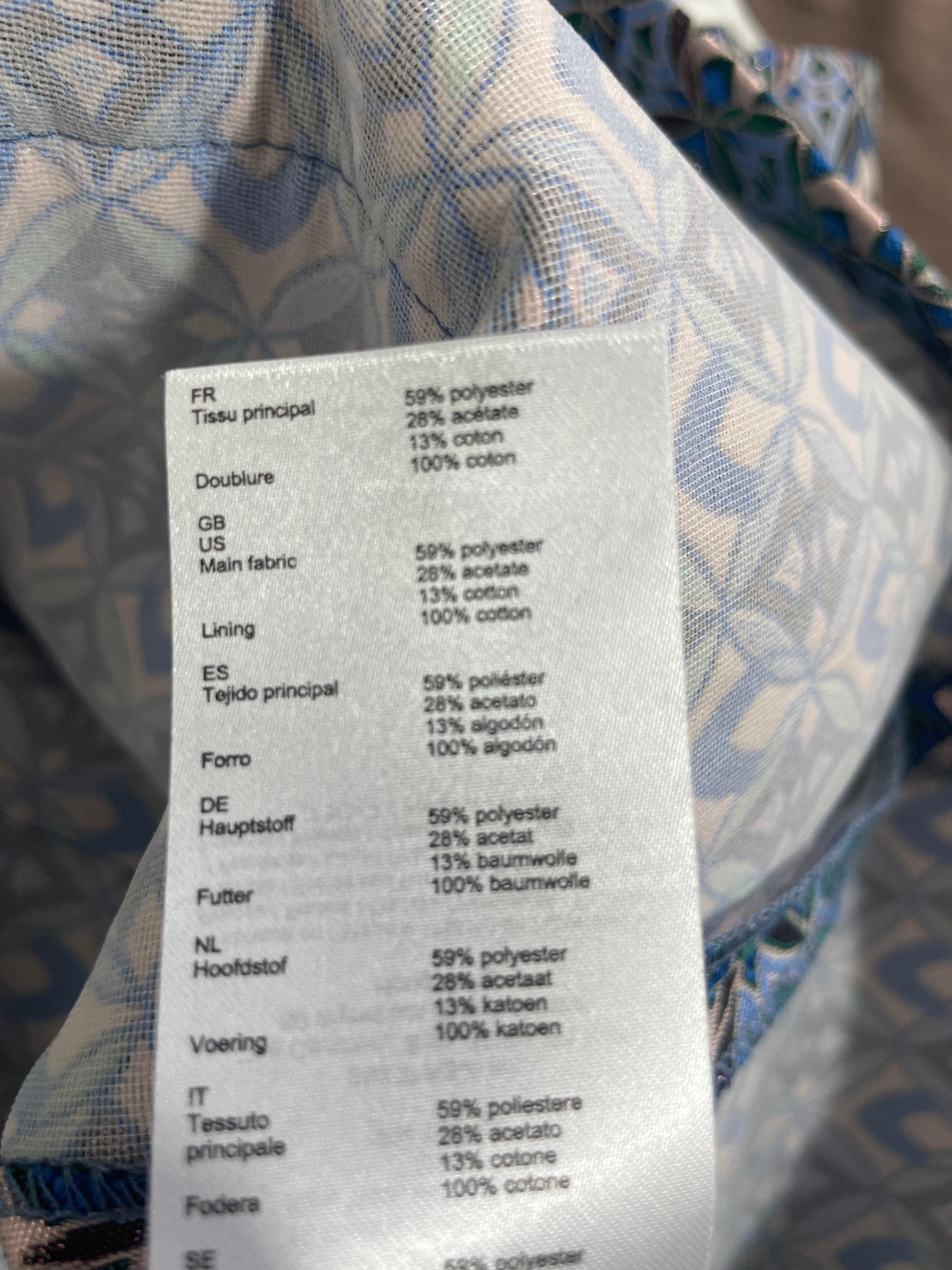 1. Maje jacquard skirt fabric composition label showing polyester acetate cotton blend