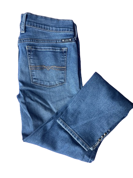 A pair of Lucky Brand Charlie Skimmer Jeans with blue denim fabric, featuring front pockets with rivets, and small slits on the hem.