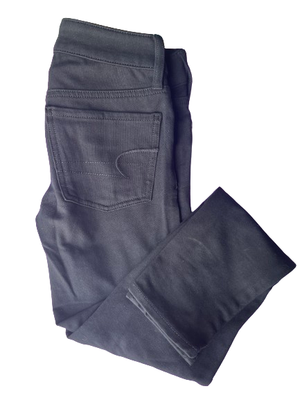 A pair of American Eagle Black Super Stretch Jeggings laid out in full view, showcasing the front left and right profiles.