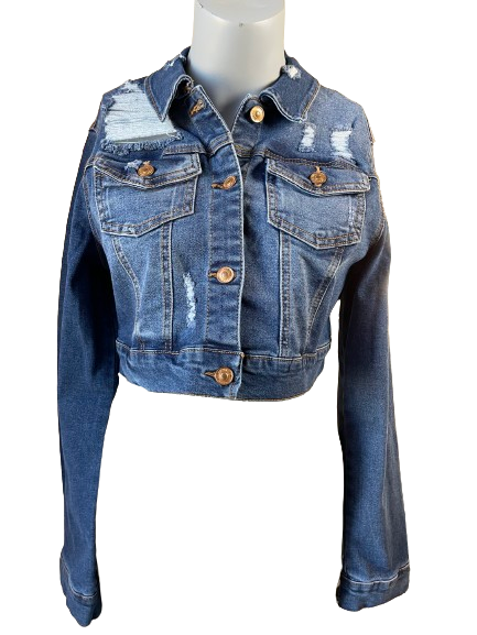 A distressed blue denim jacket with long sleeves, displayed on a mannequin. The jacket has a collared neckline and is adorned with buttons and a patch on the elbow area.