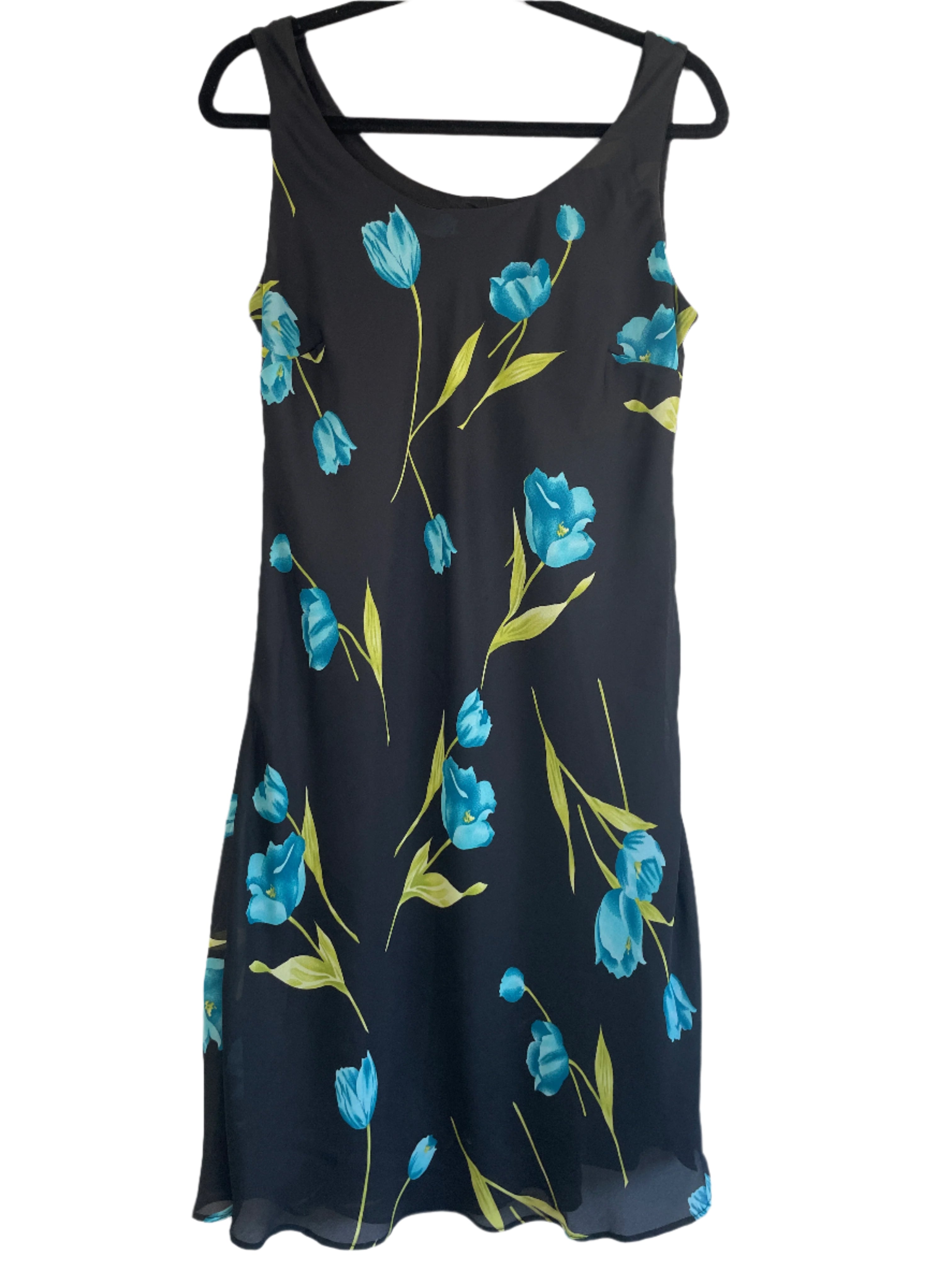 Tradition black sleeveless dress with bright blue floral print, size 12, hanging on a black hanger against white background.