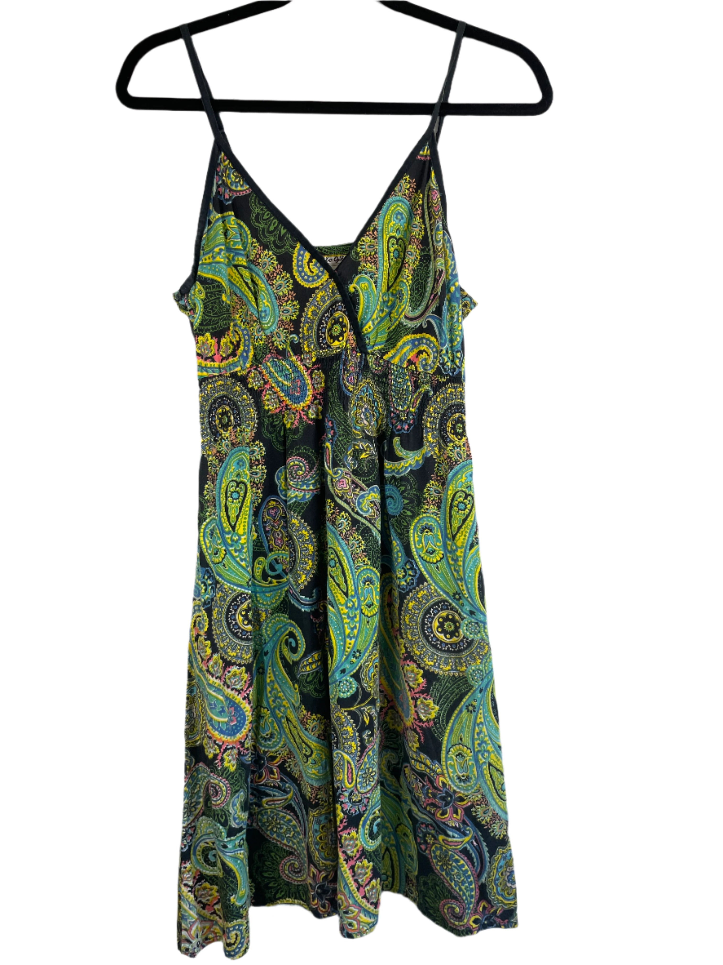 Front view of a sleeveless Cute Options summer dress in multicolour paisley print with spaghetti straps and gathered waist on black background.