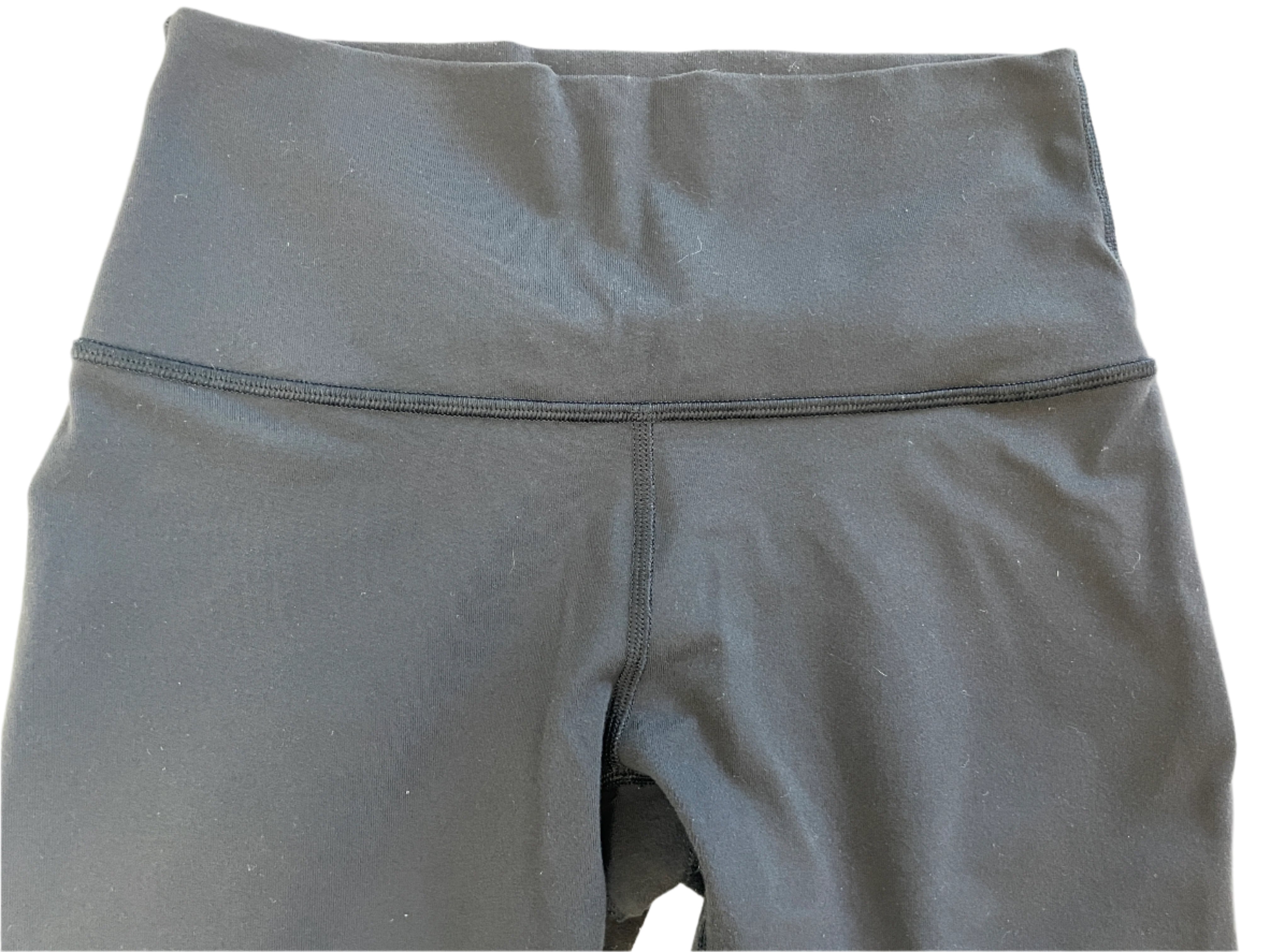 Black leggings on a light gray background