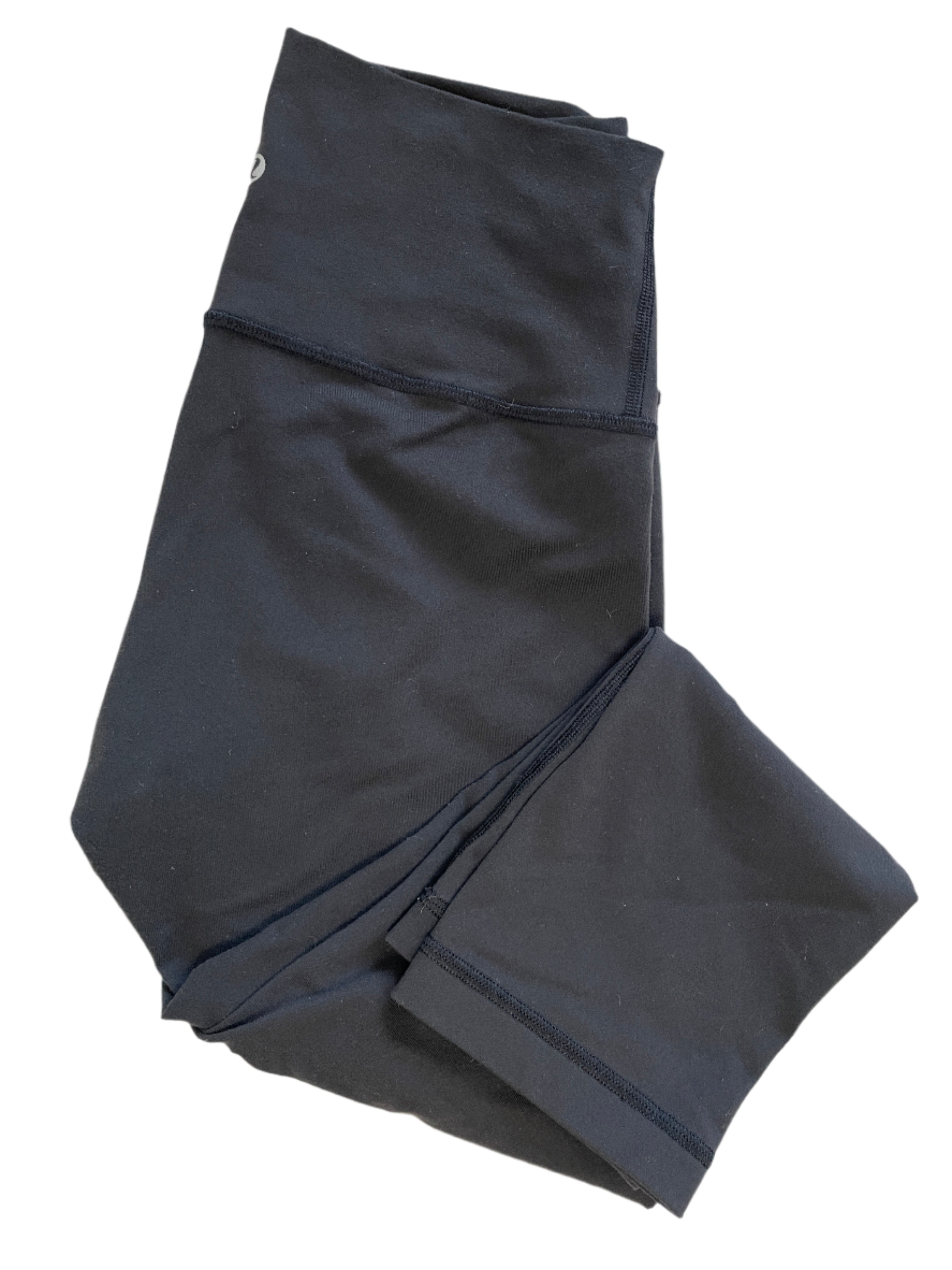 Lululemon black capri tights size 6 folded and flat lay showing front, back, and waistband in excellent condition