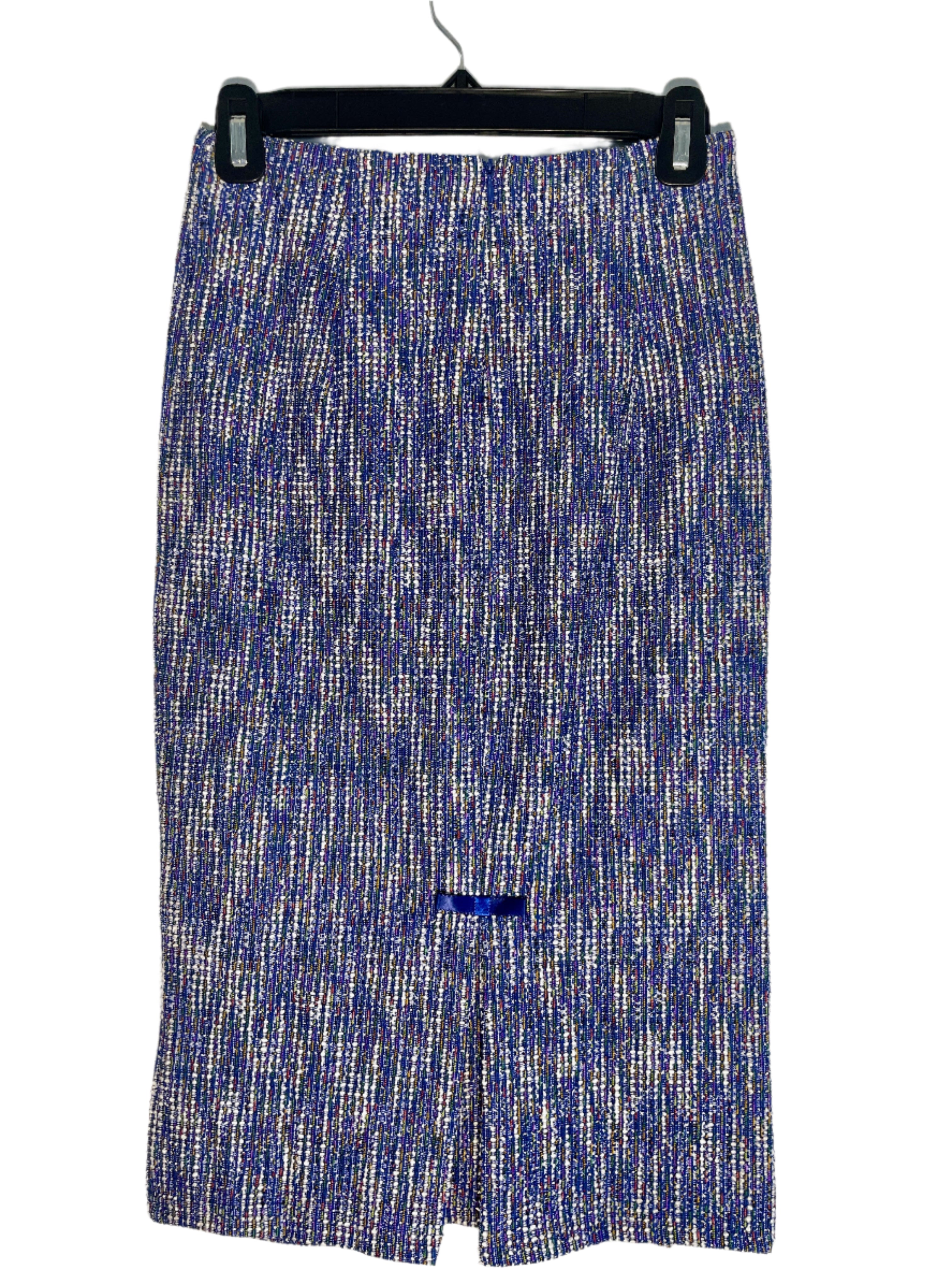 Back view of blue and multicolour Belle Pogue pencil skirt with subtle sparkle and bow accents, size small, displayed hanging on a black hanger.