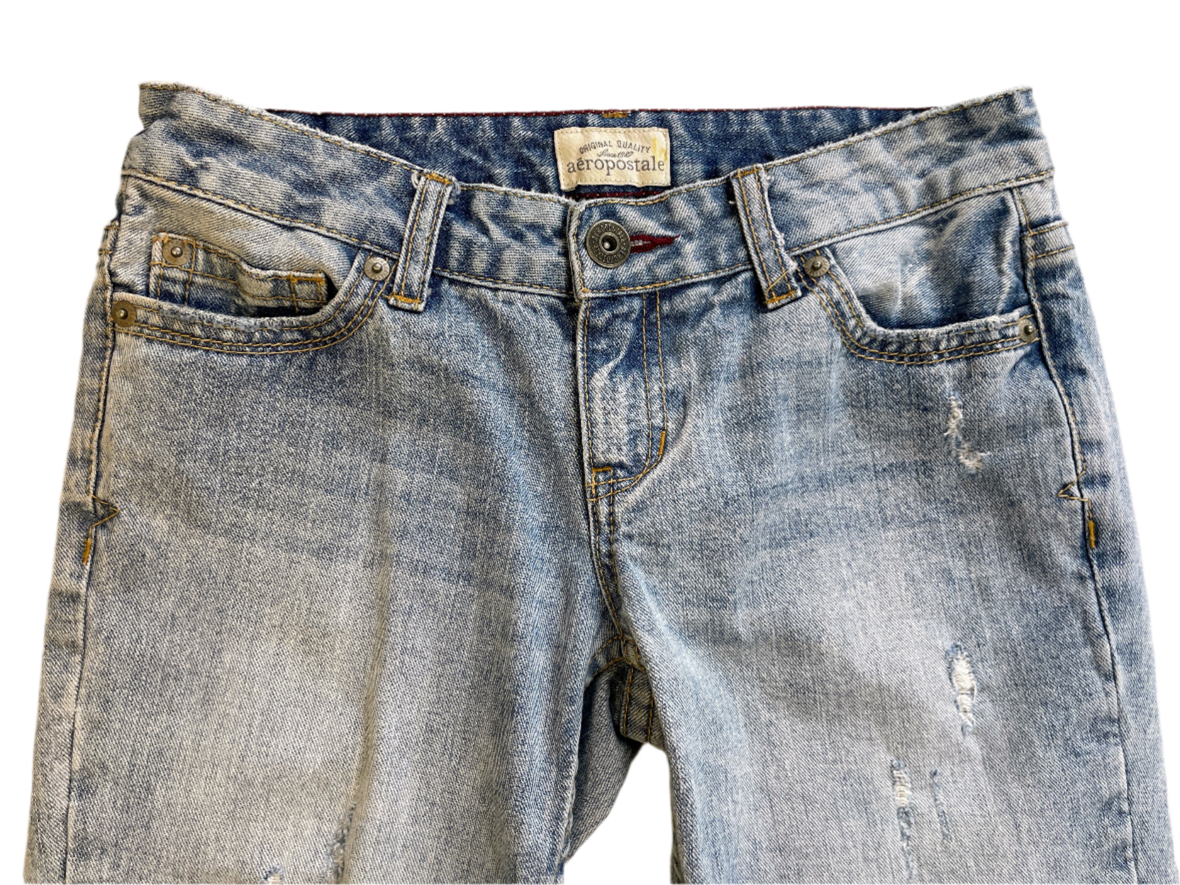 Blue jeans with a brand label on a white background