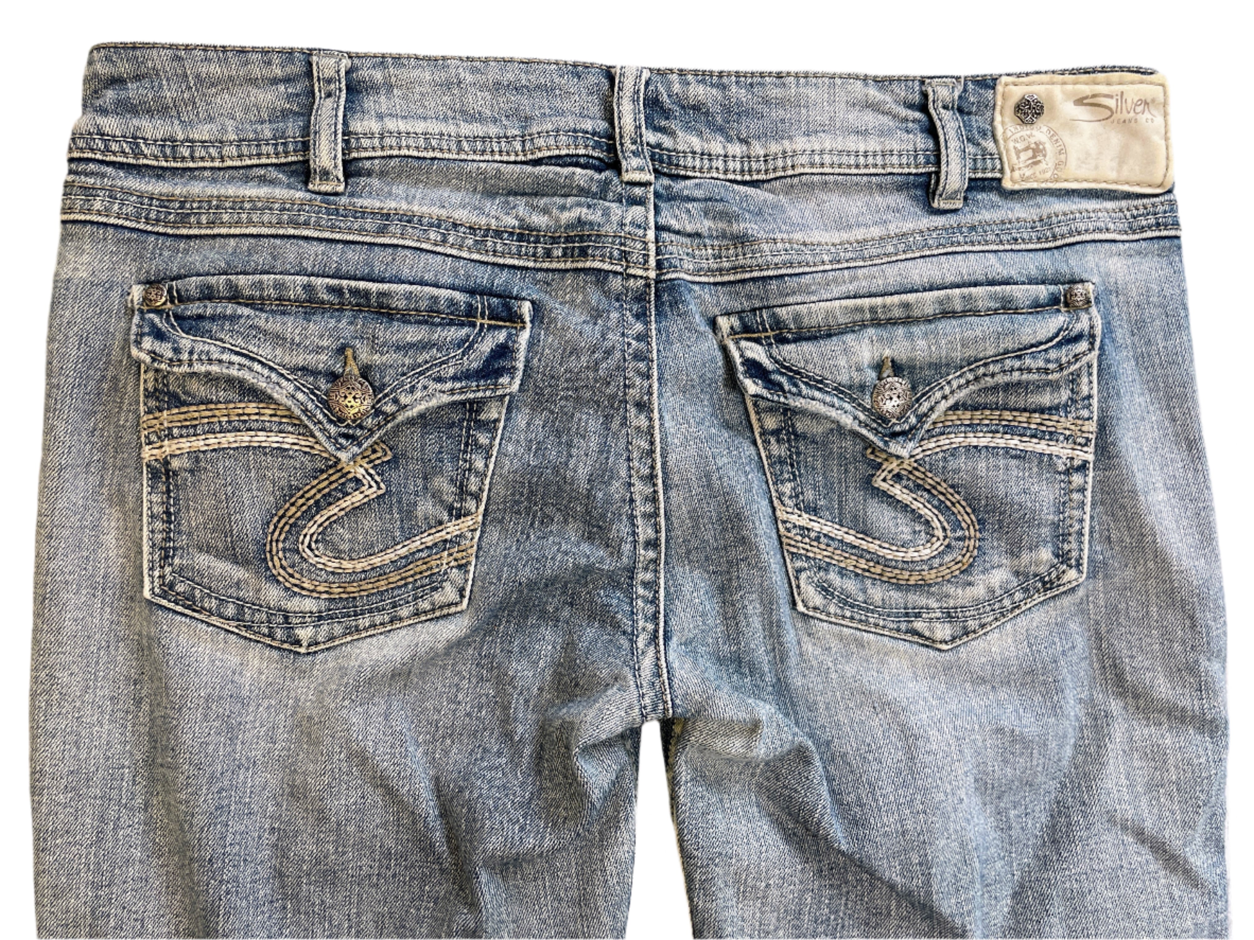 Pair of blue jeans with brand logo on a light background