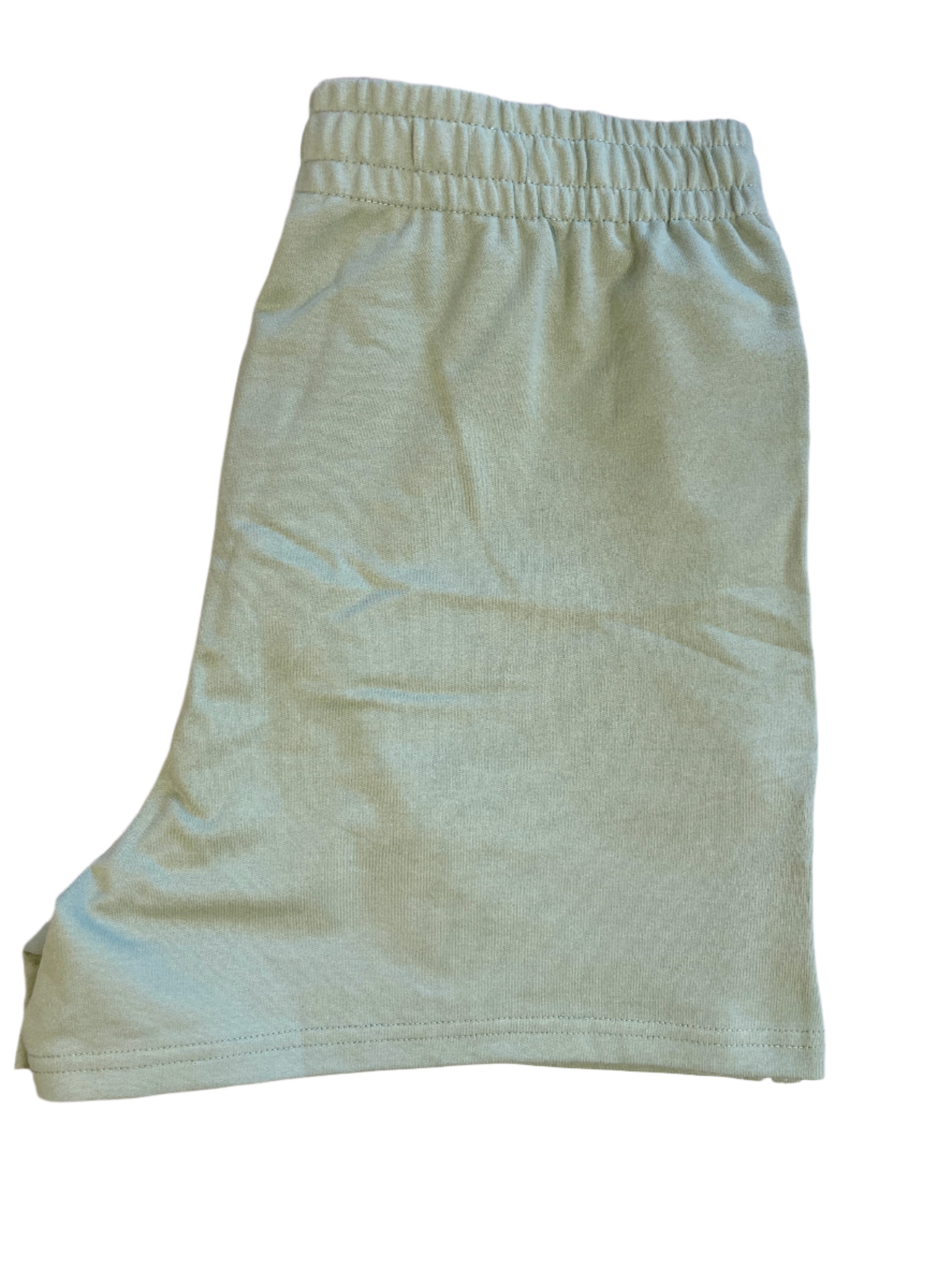 Light green shorts on a white surface