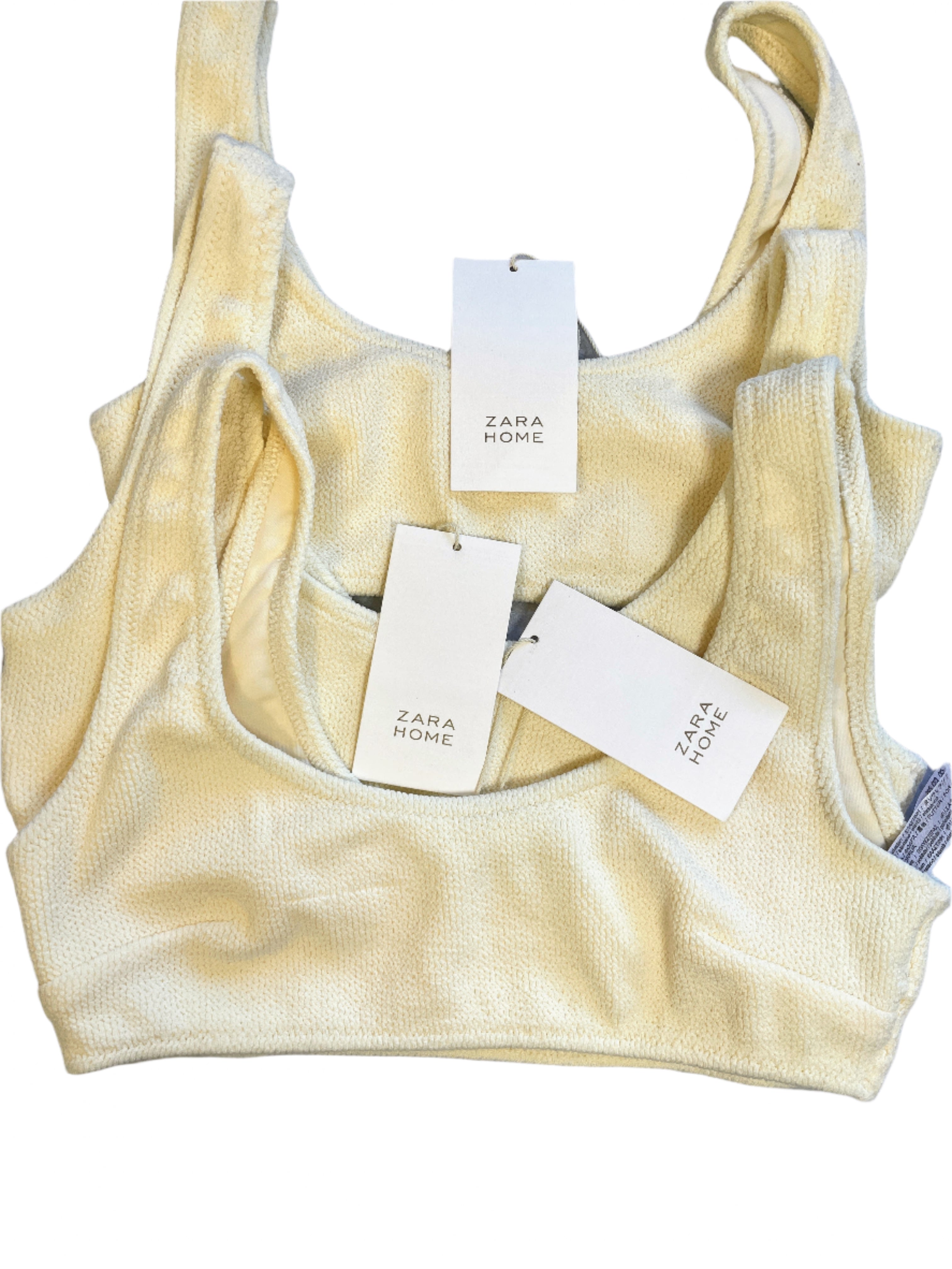 Yellow tank top with Zara Home tags on a gray surface