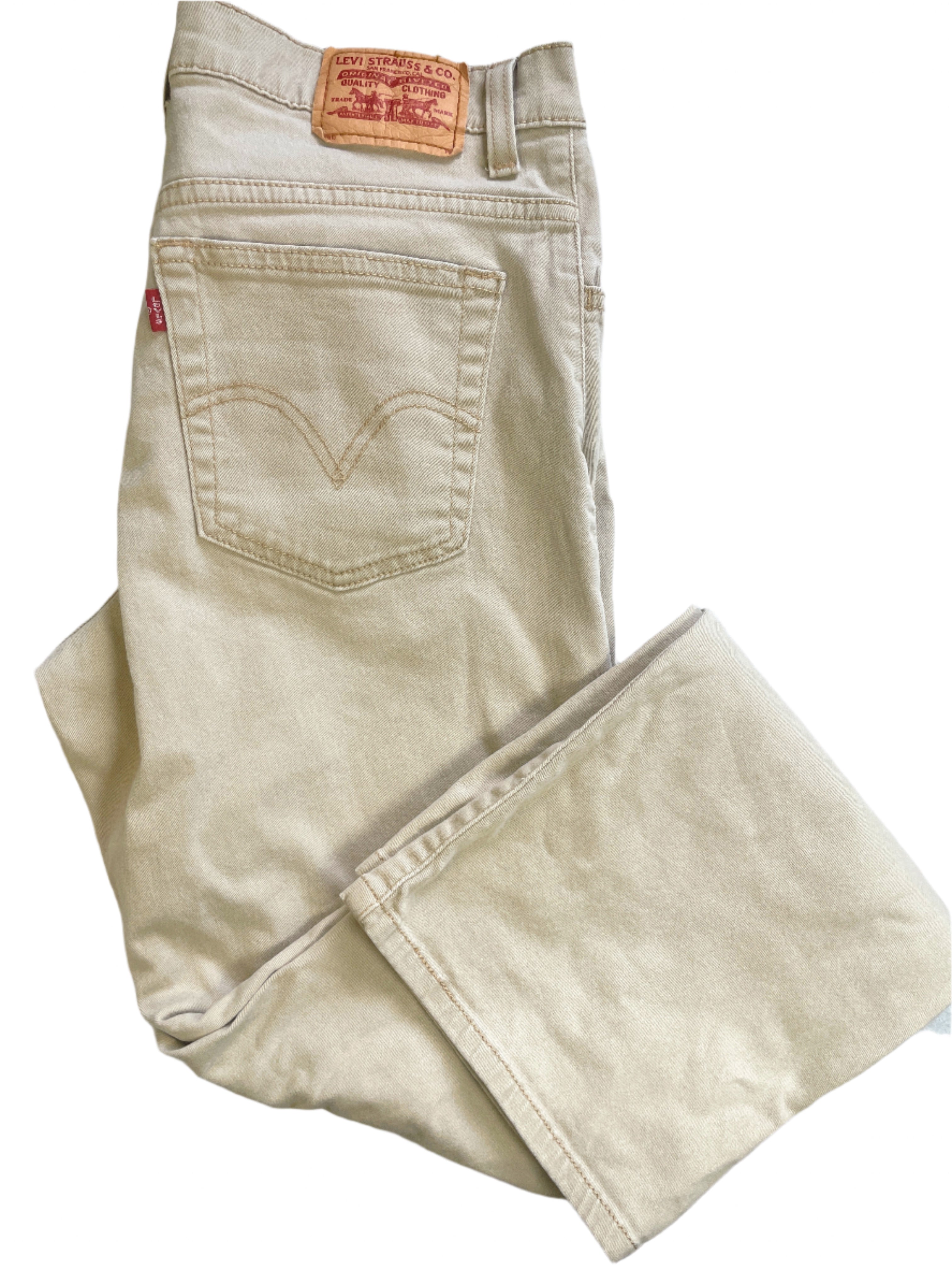 Beige Levi's jeans on a white surface