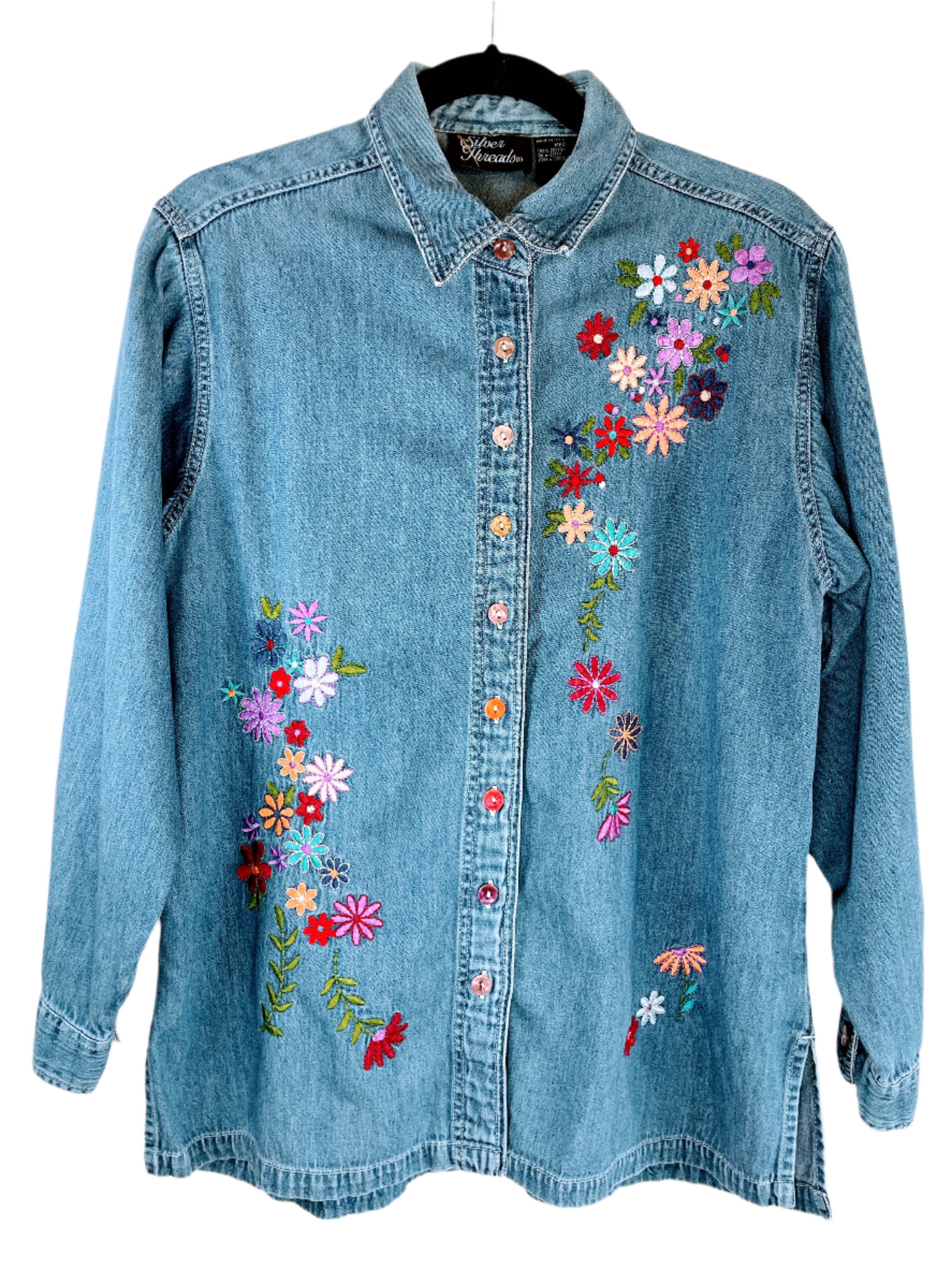 Front of Silver Thread denim shirt with colourful floral embroidery and multicoloured buttons, size medium.