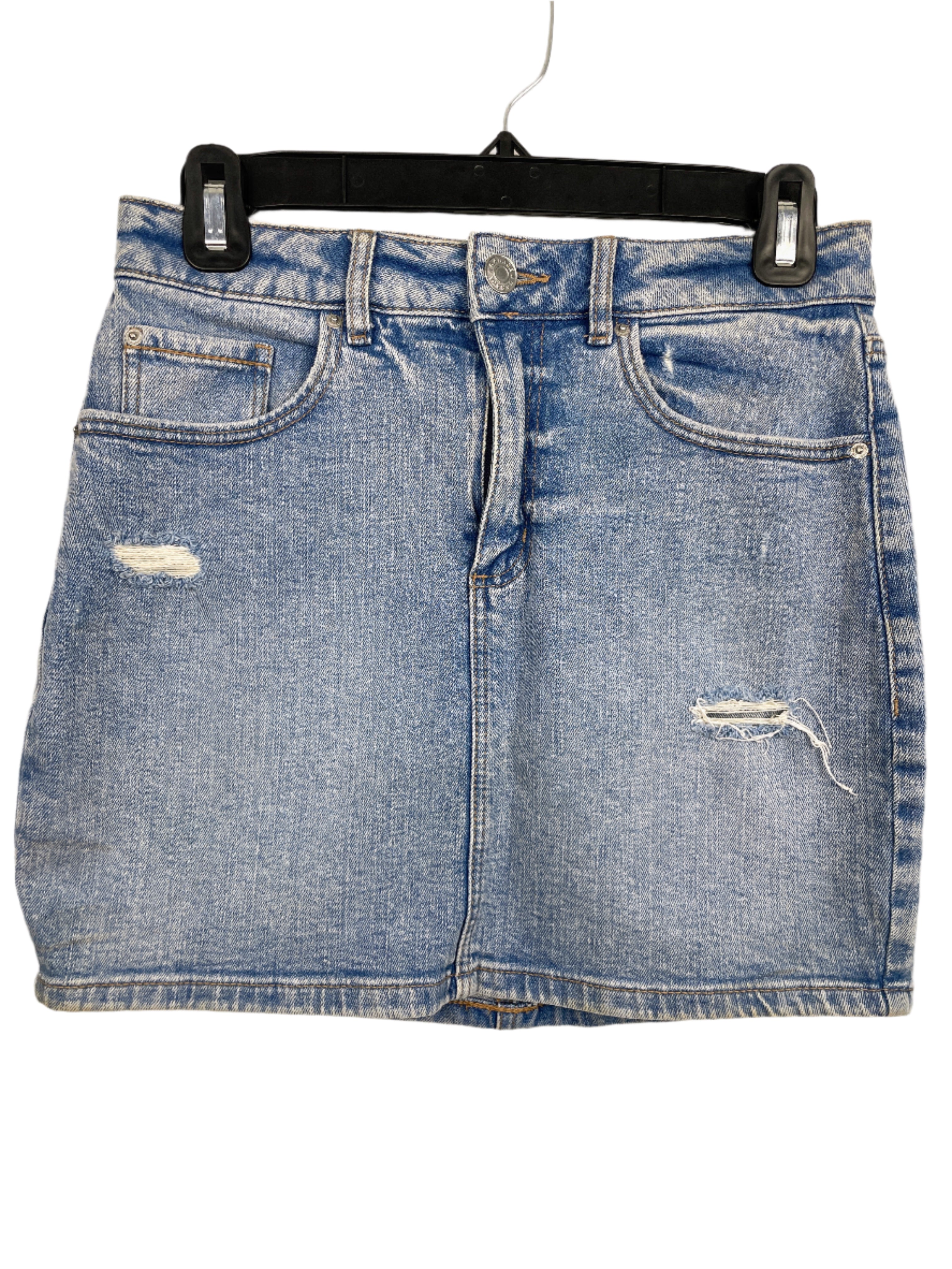 Front view of Garage light wash denim mini skirt, size small, with distressed details and five-pocket style.