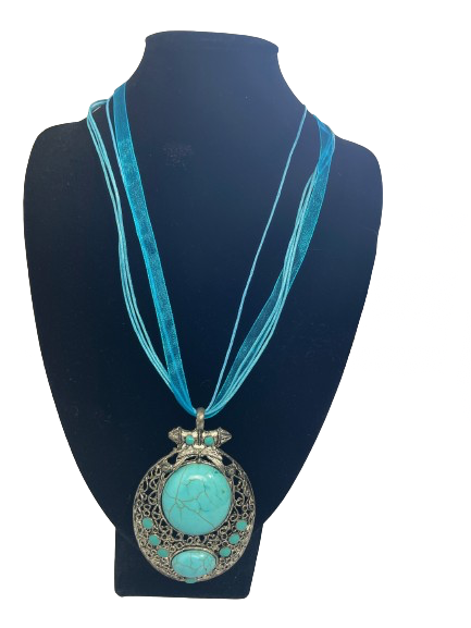 Silver filigree statement necklace with faux turquoise stones and blue ribbon multi-strand design