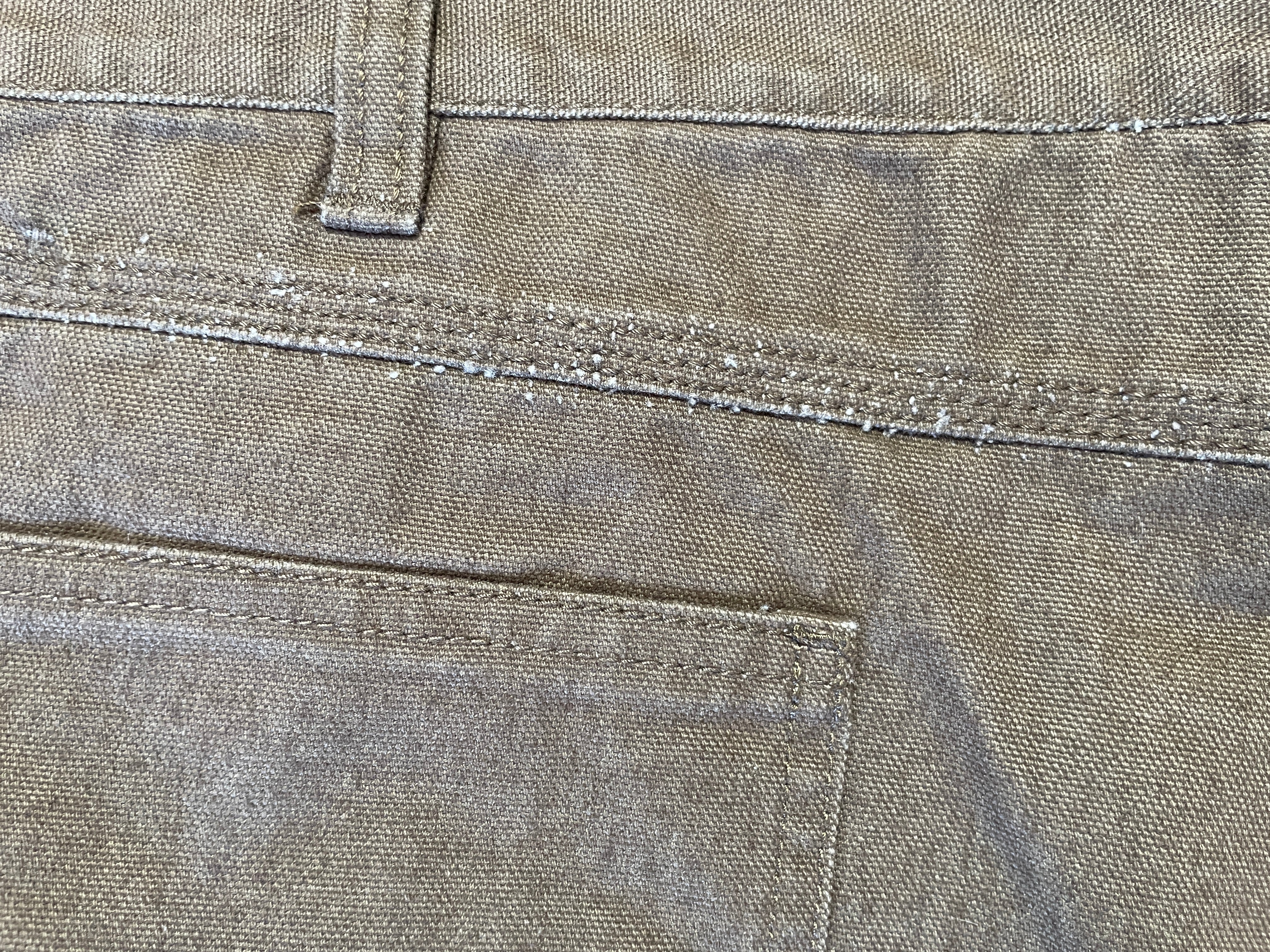Close-up of a brown fabric with stitching details