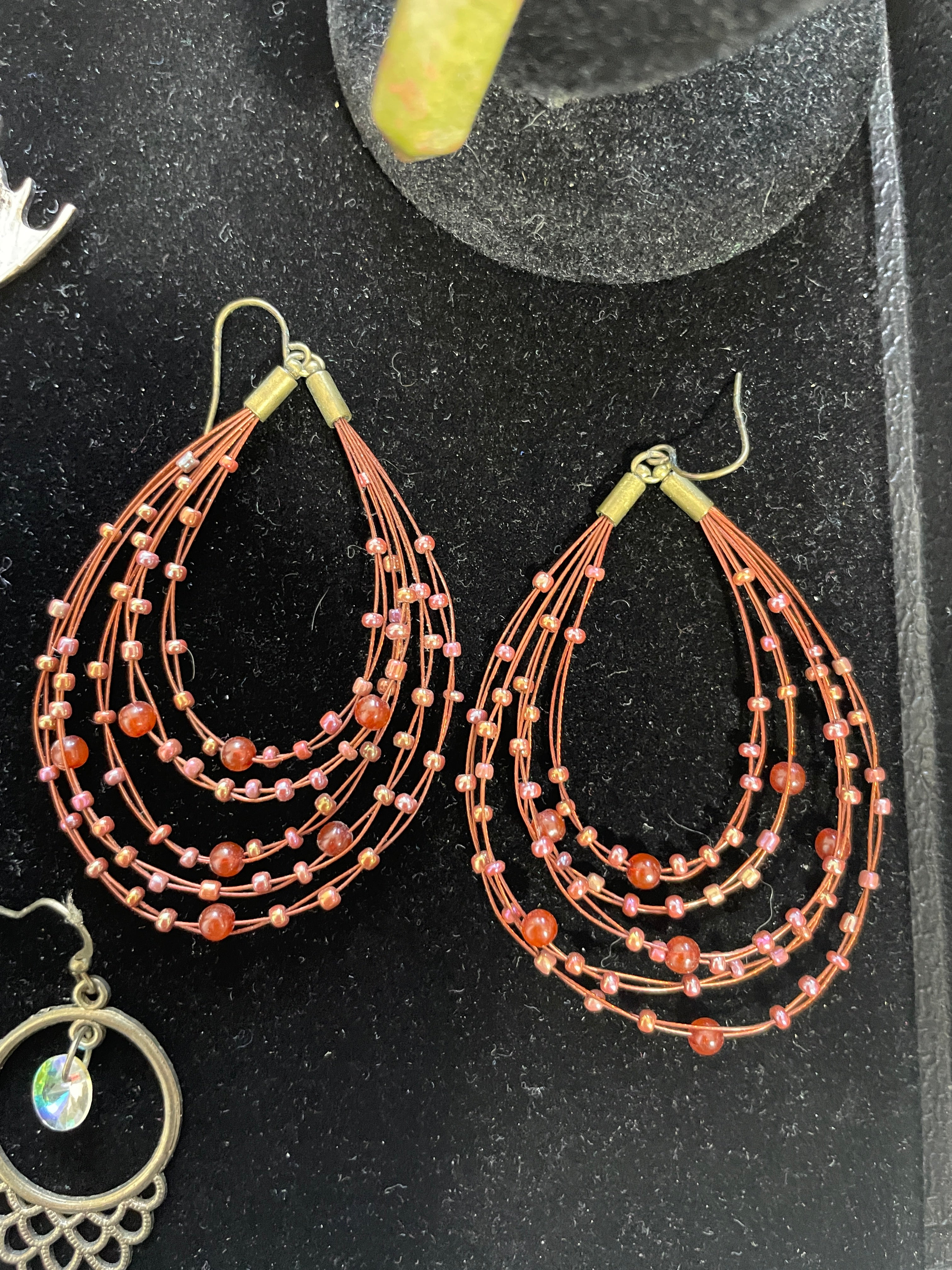 Beaded earrings on a black surface