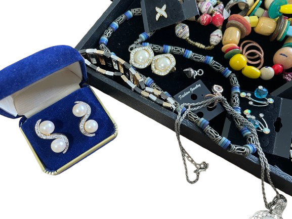 Jewelry set including earrings, necklaces, and bracelets displayed on a white background.