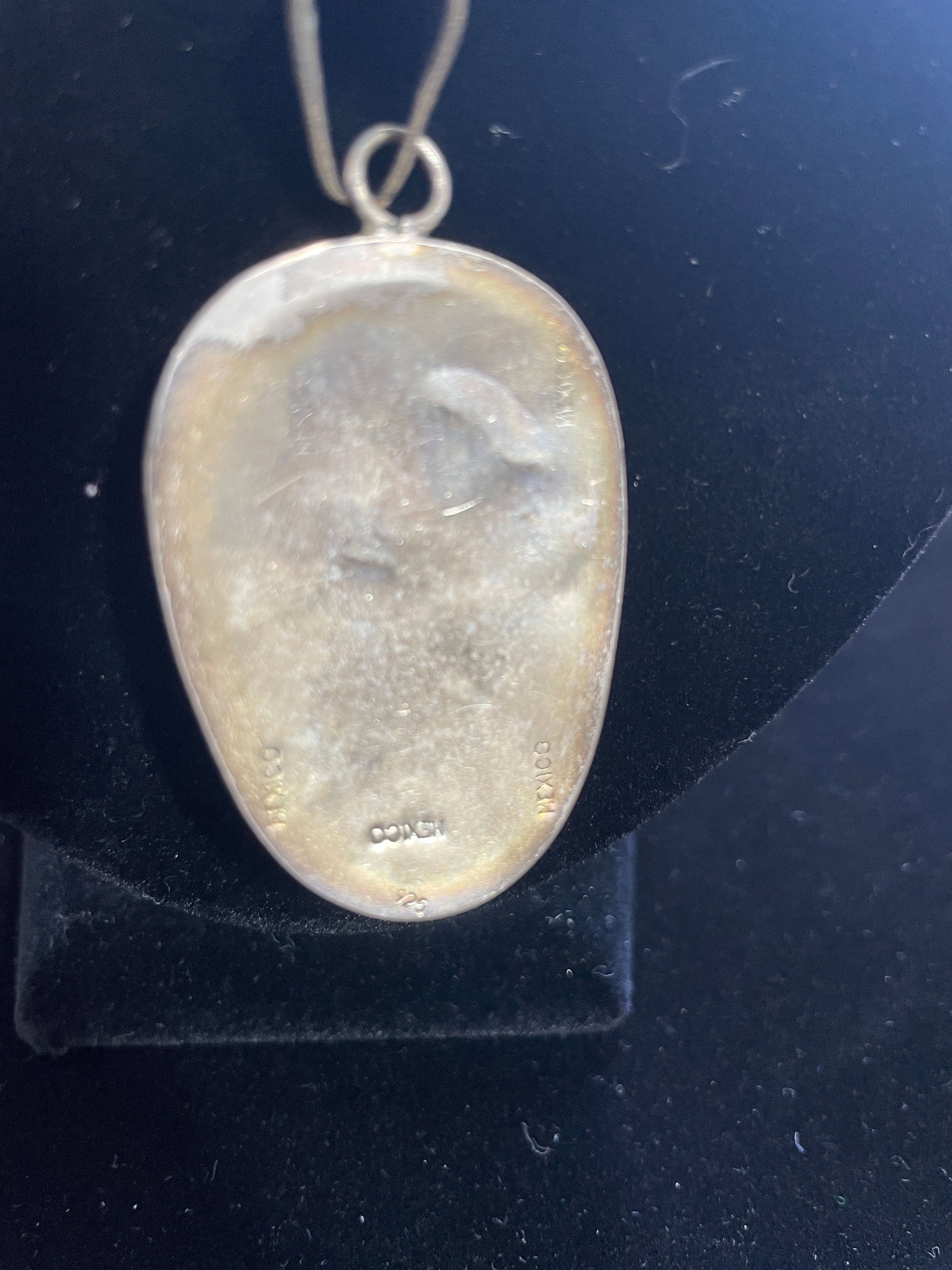 Back of pendant showing "925 Mexico" authenticity stamp
