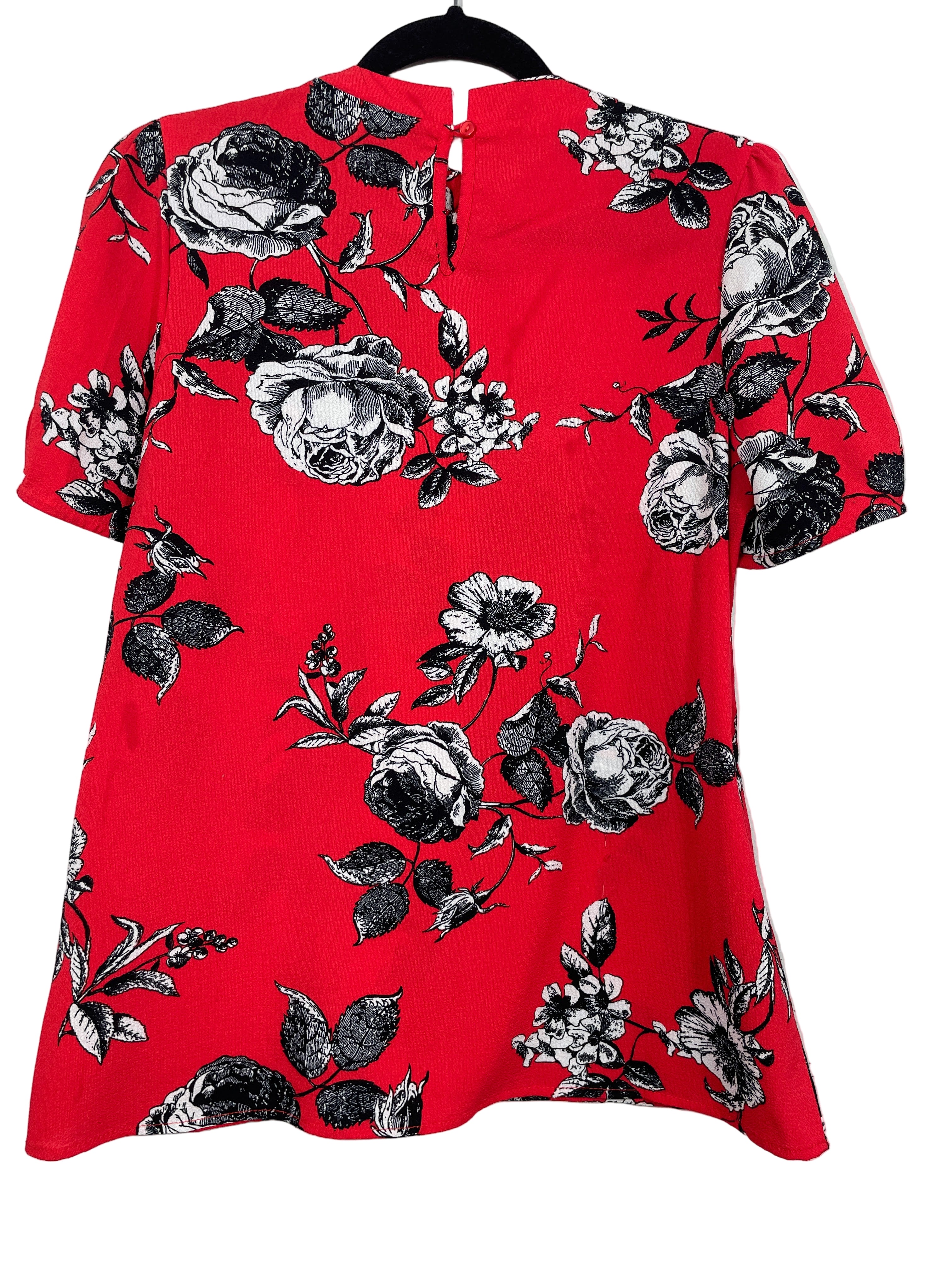 Back view of Erin Blair red floral blouse showing keyhole button closure.