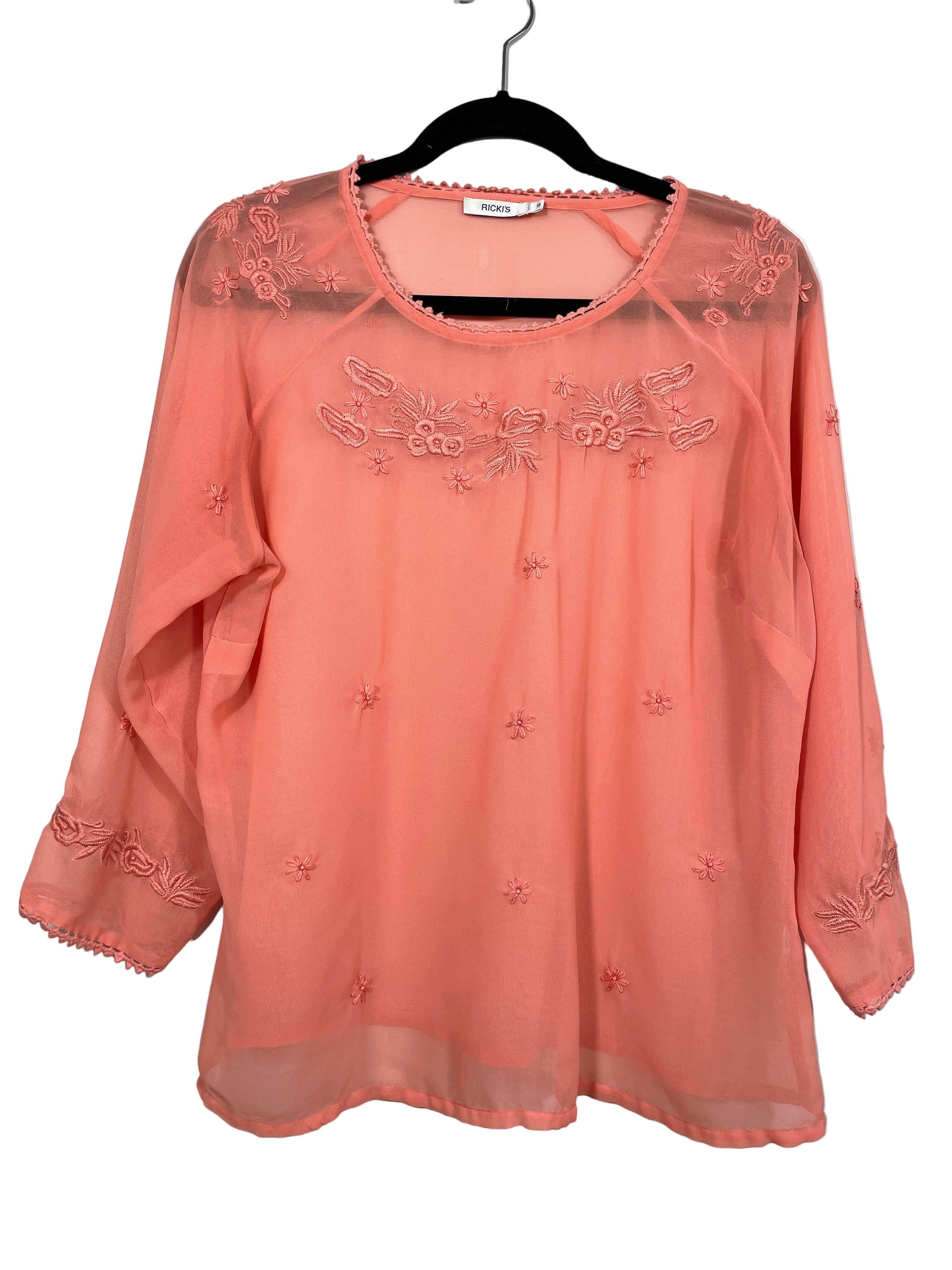 Front view of Ricki’s orange sheer blouse with embroidered floral detail – size 12