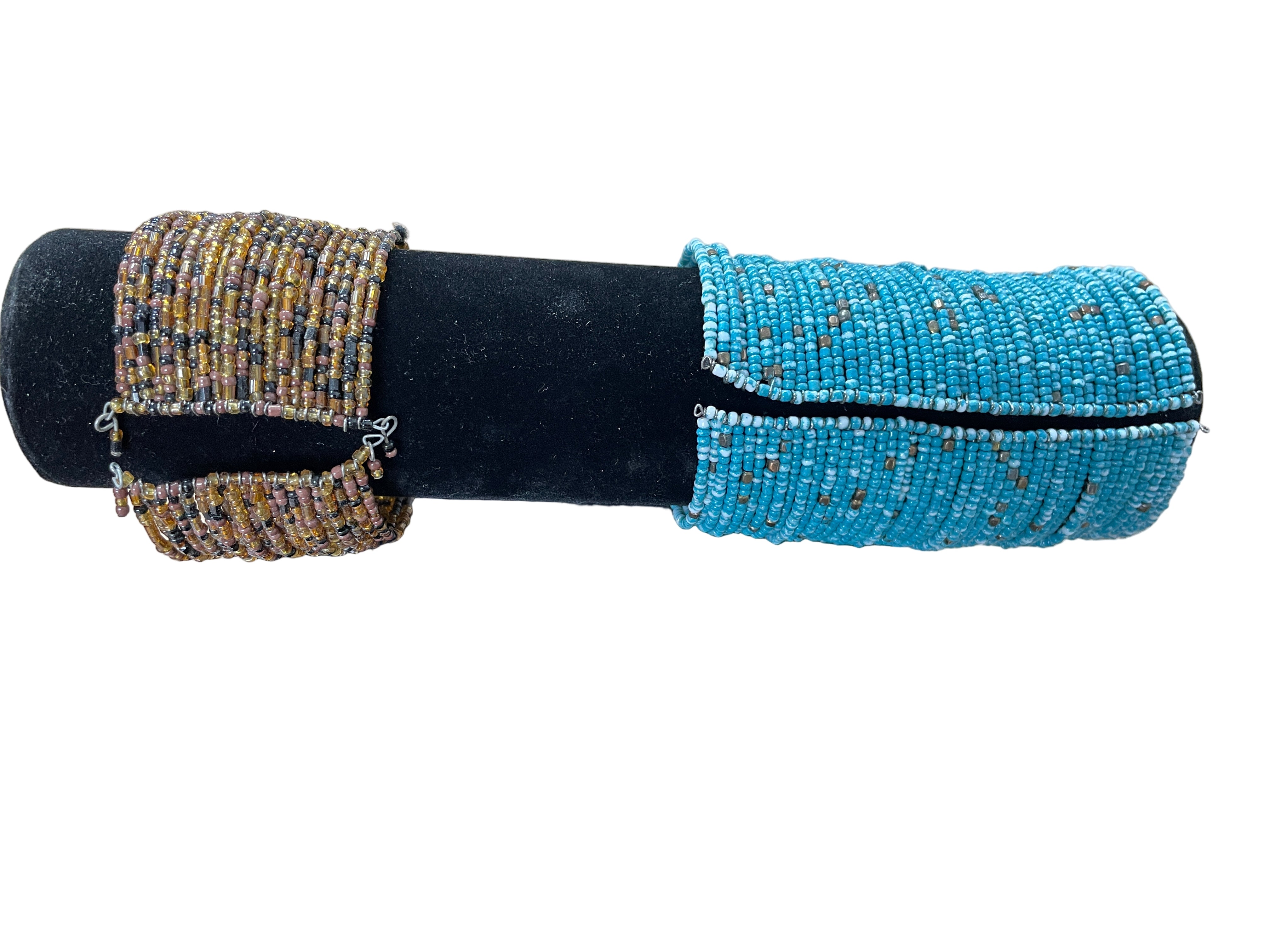 Two beaded bracelets on a black stand