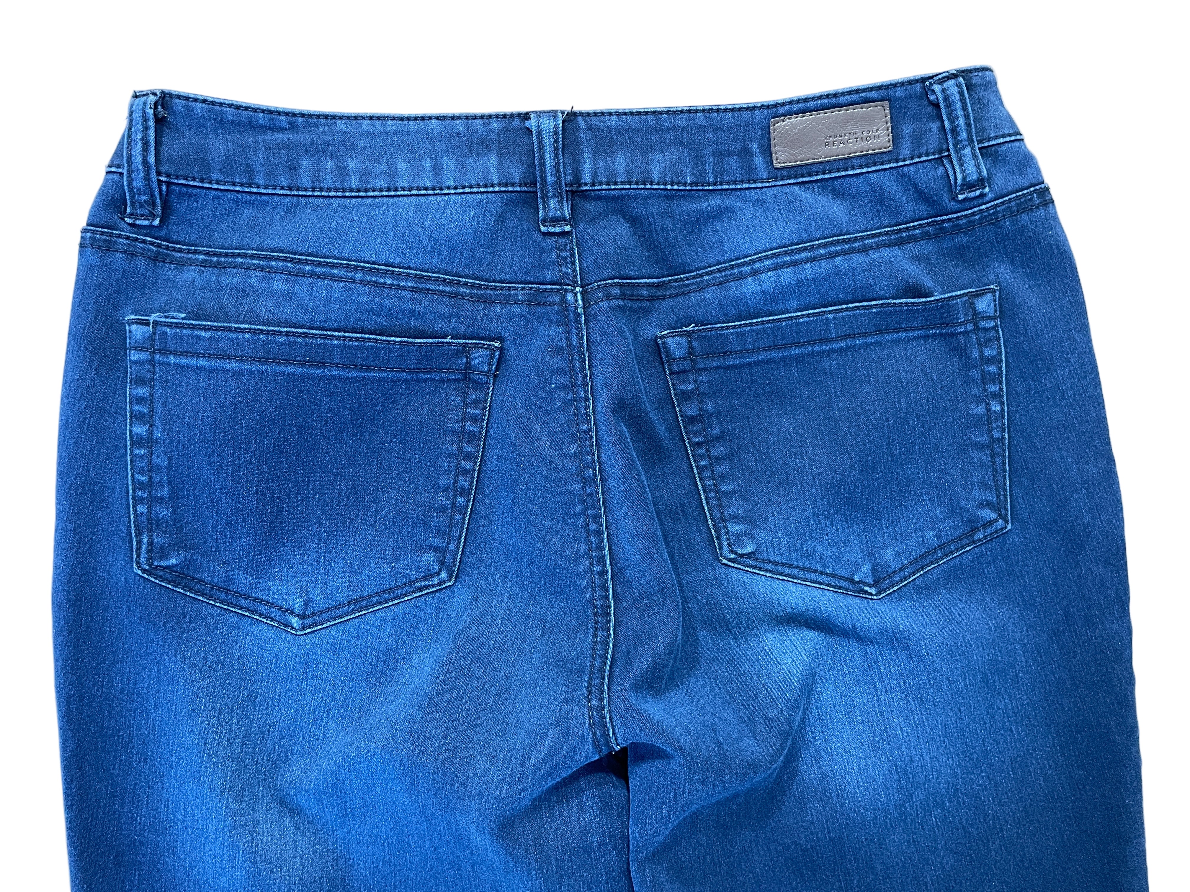 Back view of Kenneth Cole Reaction skinny jeans showing pockets and label