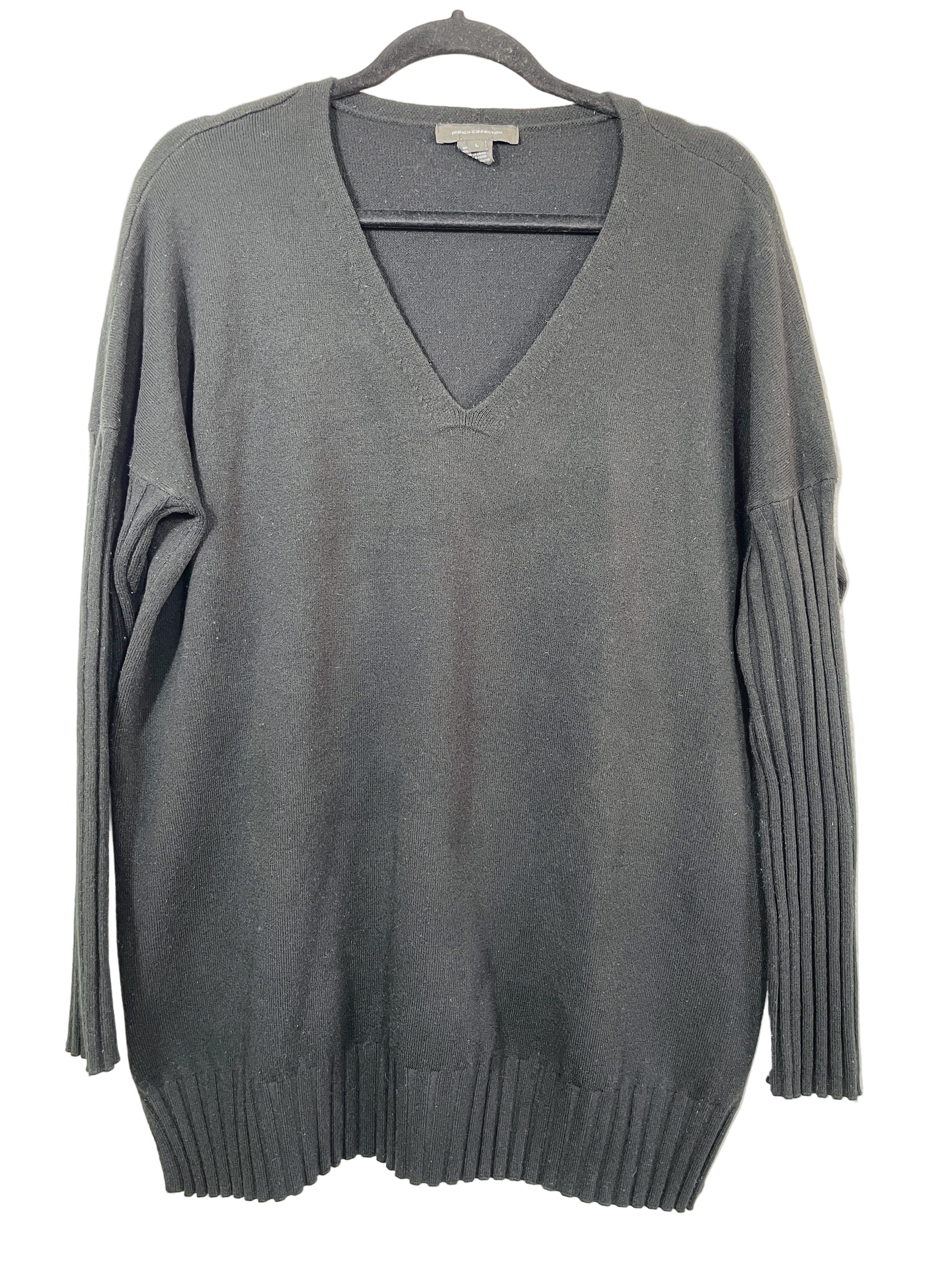 Front view of French Connection black V-neck sweater with ribbed sleeves and side slits