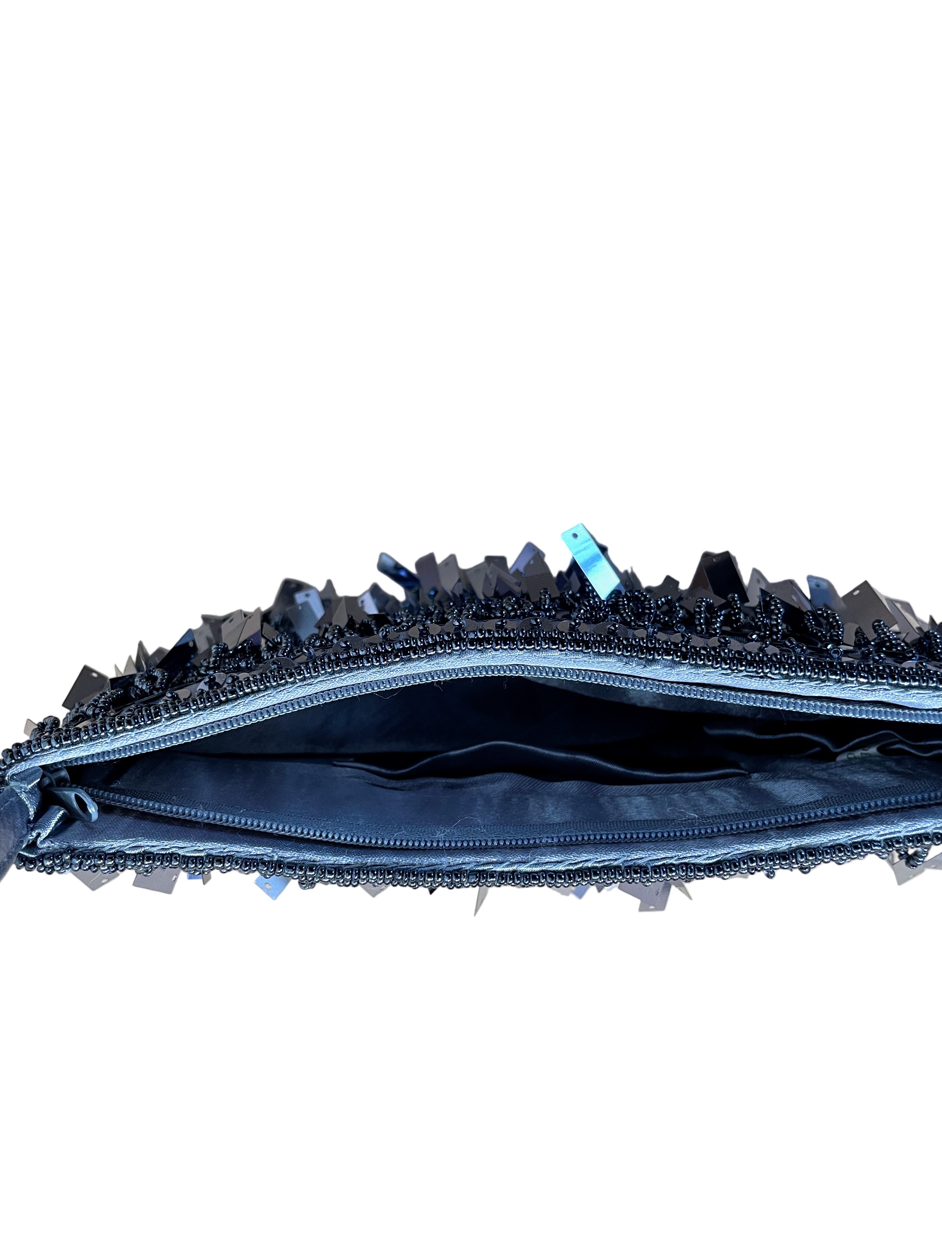 Interior view of beaded evening bag showing satin lining and pouch