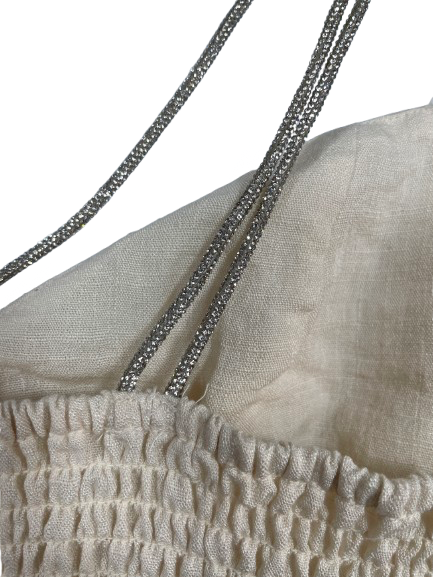 Close-up of sparkly straps on beige linen-look H&M crop top.