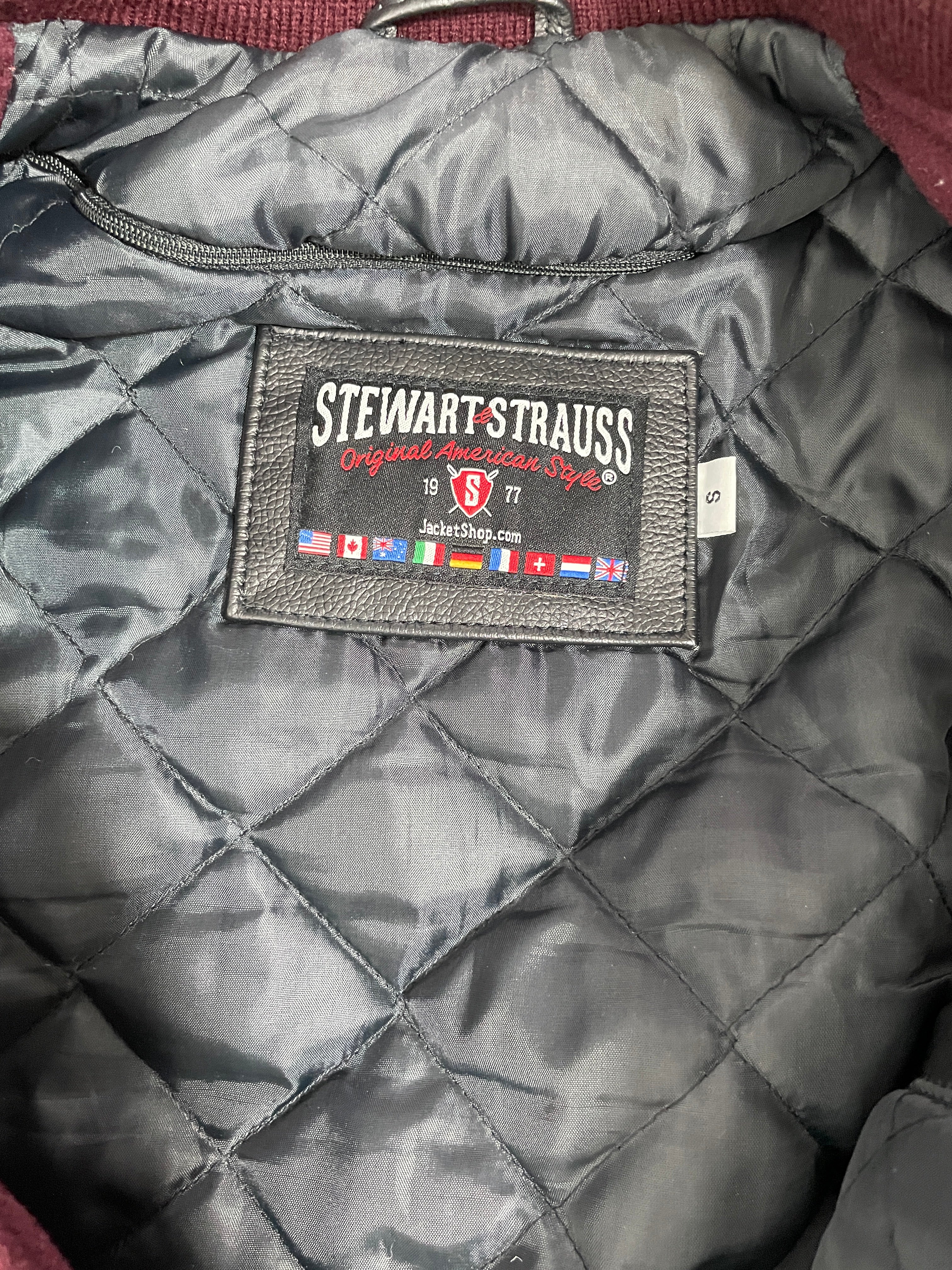 Quilted jacket with a brand label on a textured surface