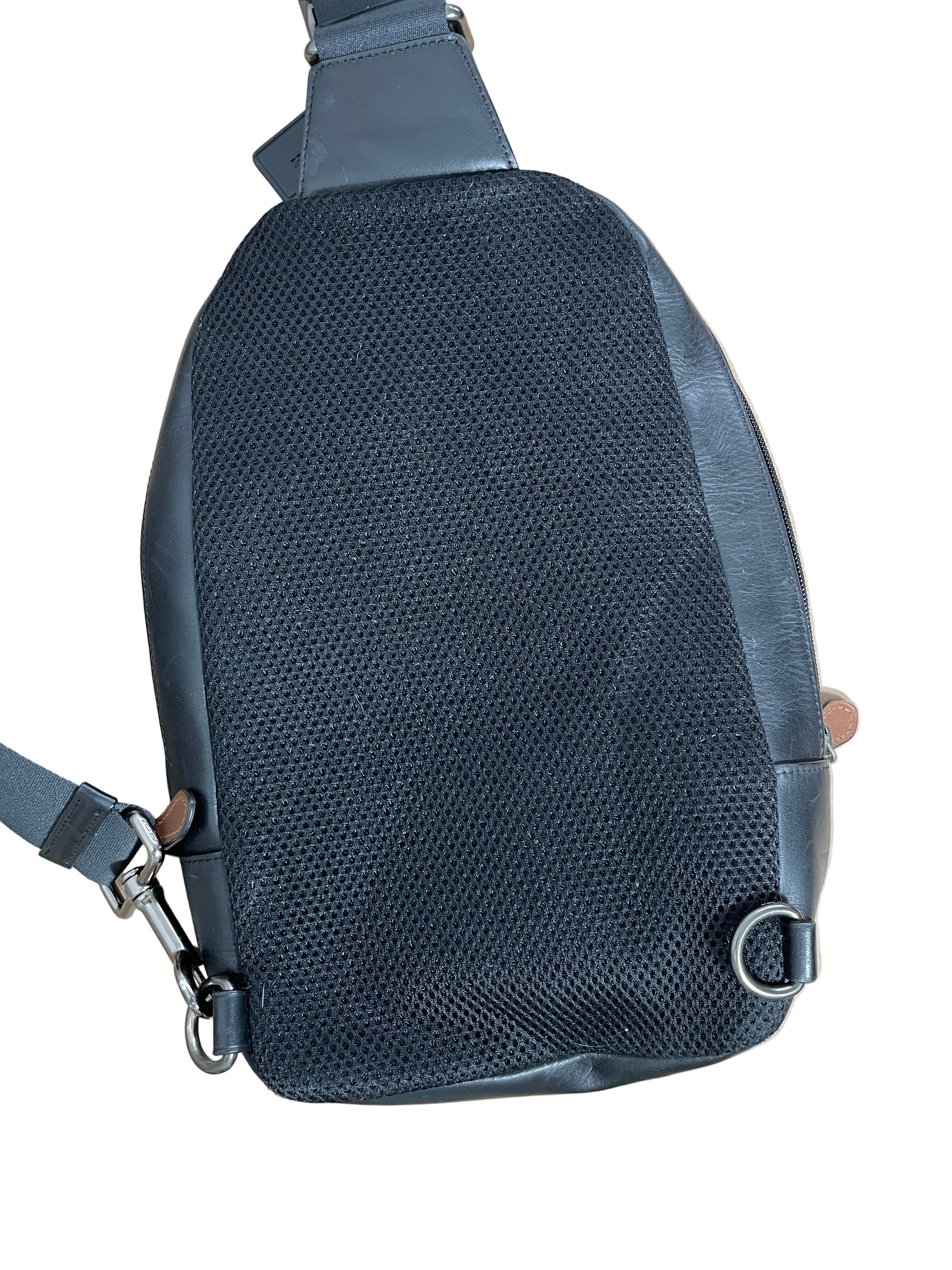 black coach crossbody bag back view perforated