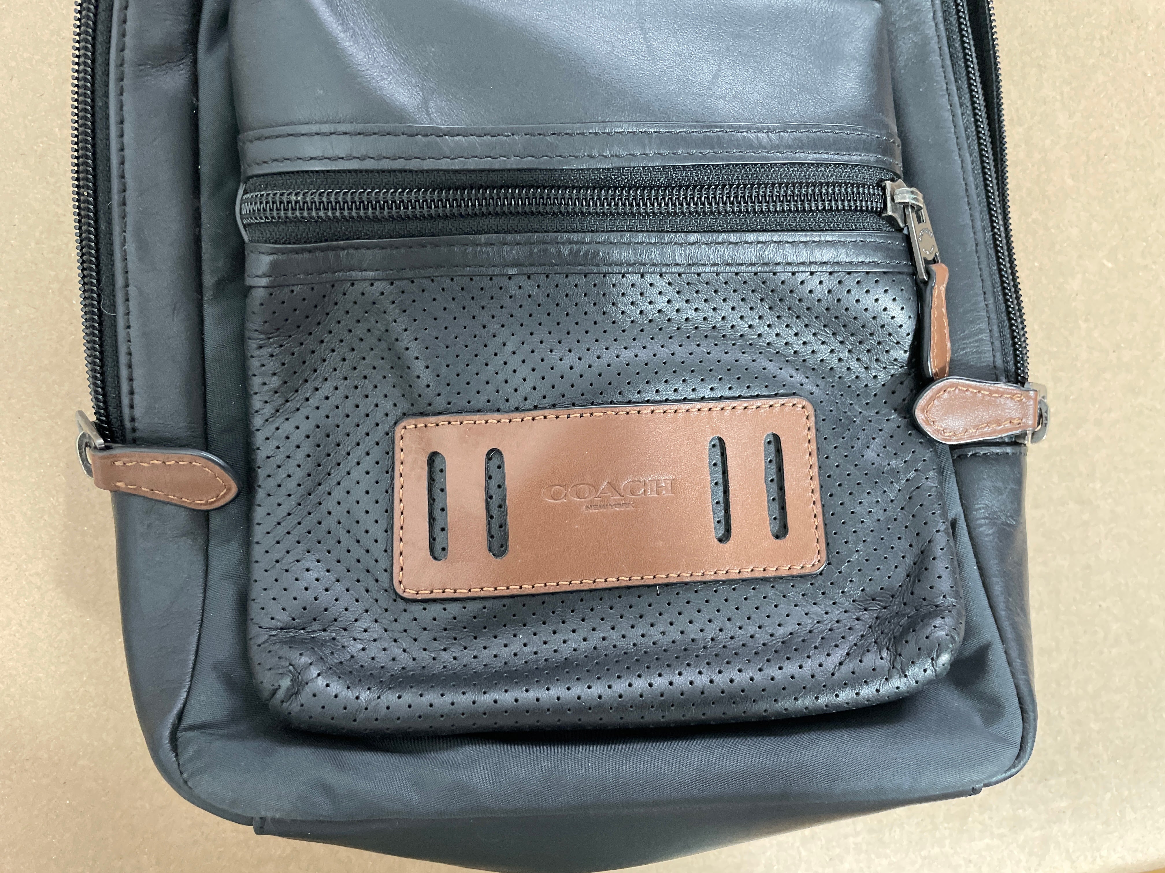 Coach perforated terrain bag