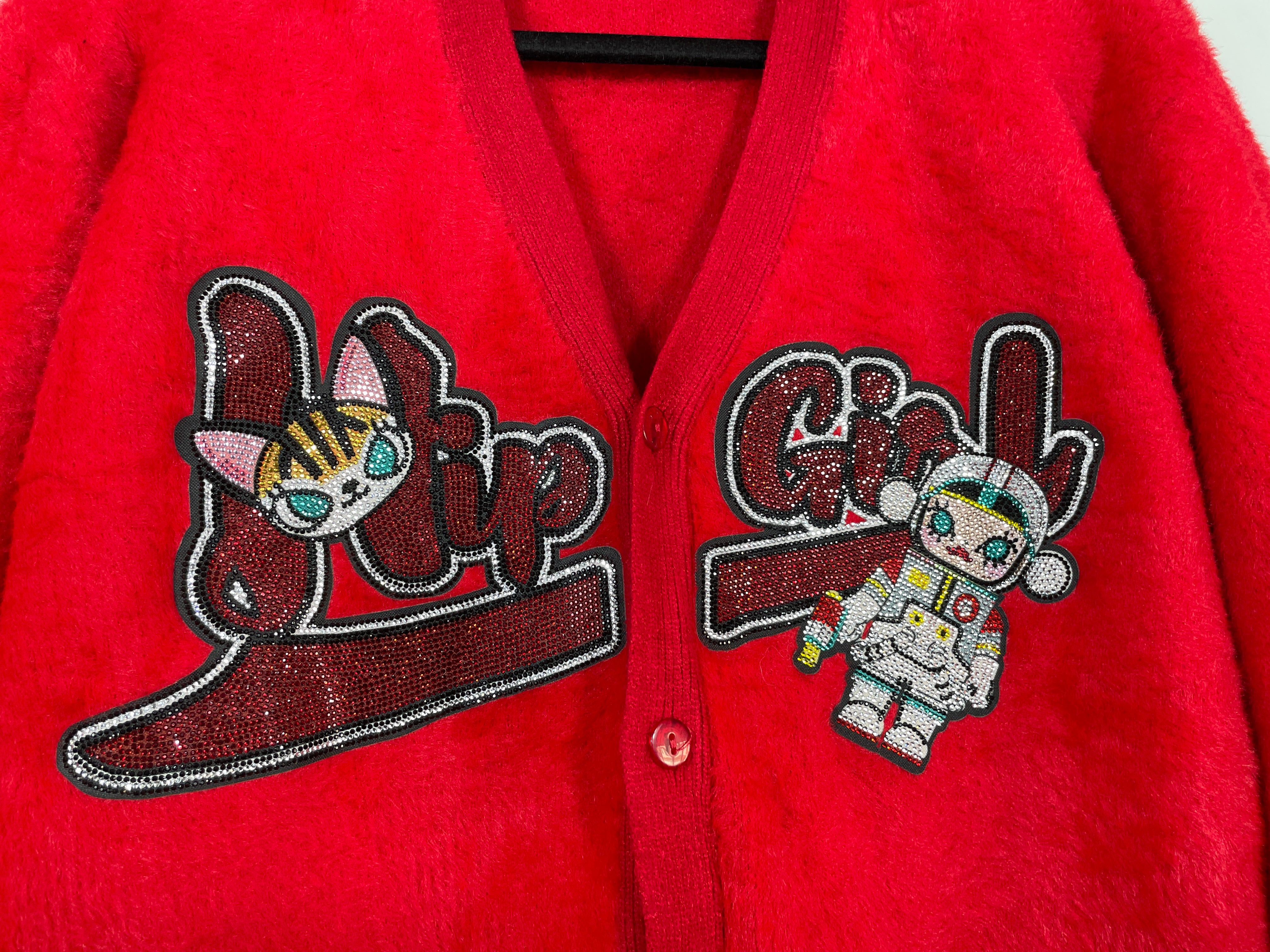 Close-up of “Hip Girl” rhinestone graphic and astronaut patch