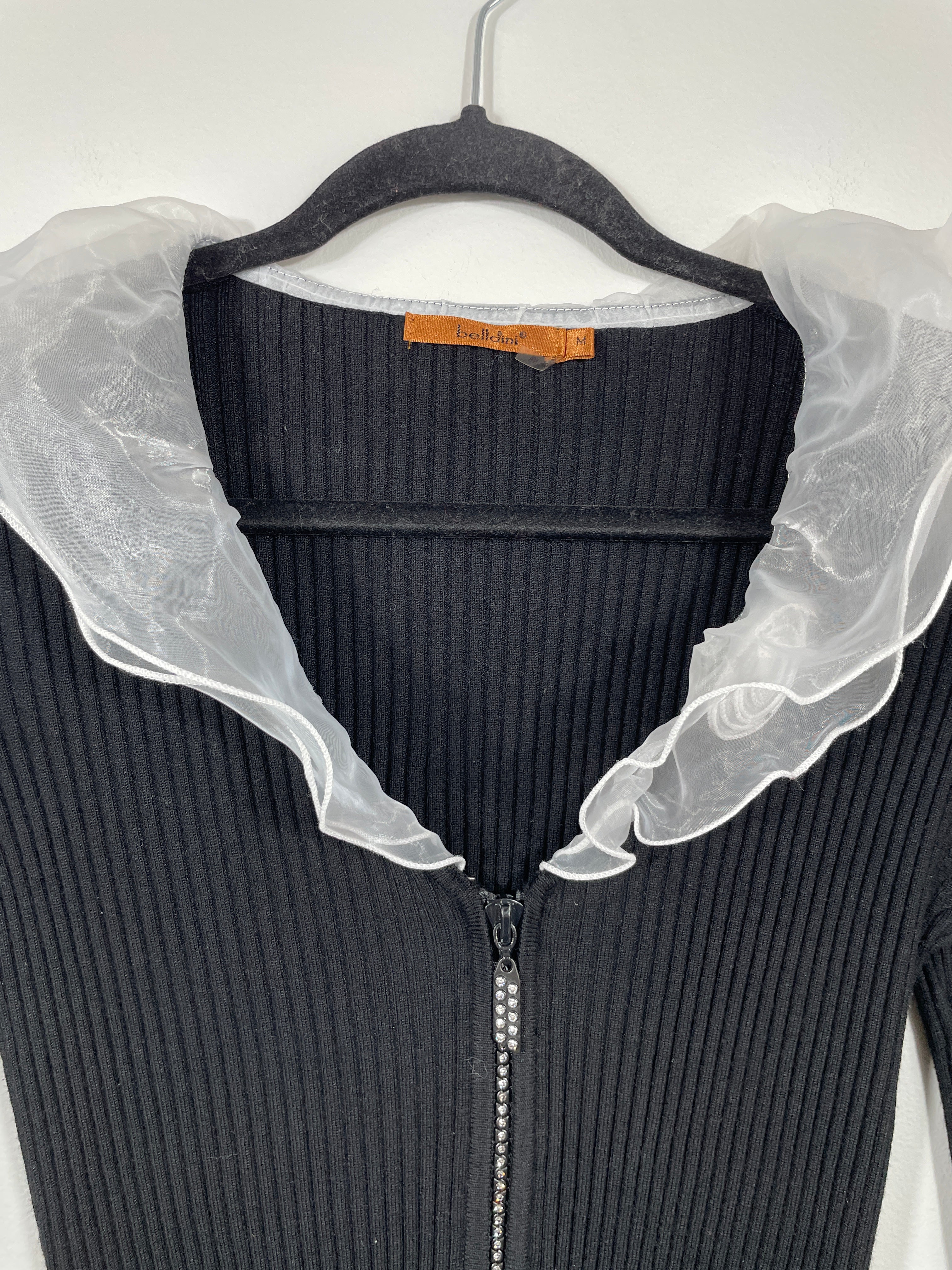 bellini black zip up top sheer ruffle neckline close up