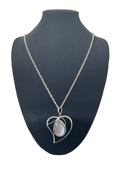 Silver tone heart frame pendant necklace with moonstone style teardrop stone front view