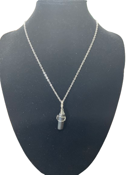 Black crystal point pendant necklace on silver tone chain front view