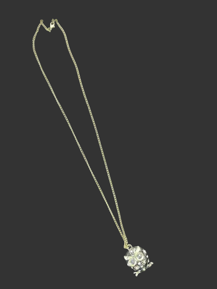 Gold tone owl pendant necklace laid flat showing full chain length