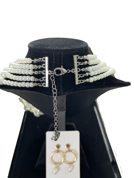 Back view of five strand faux pearl necklace with lobster clasp and extender