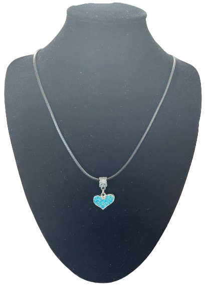 Front view of blue rhinestone heart pendant necklace on black bust