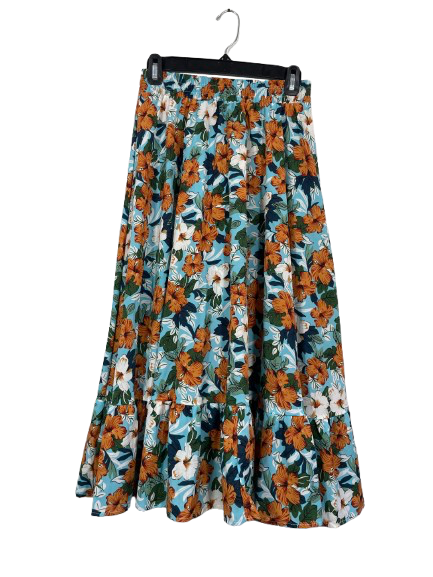 Floral patterned skirt on a hanger against a white background