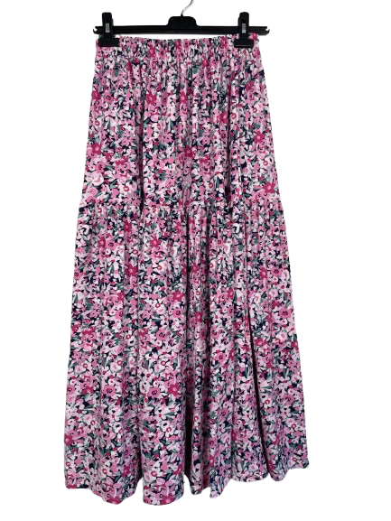 Floral patterned skirt on a hanger against a white background