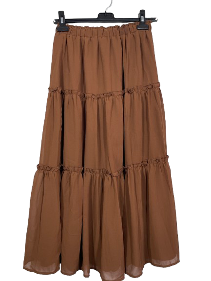 Brown tiered skirt on a hanger against a white background