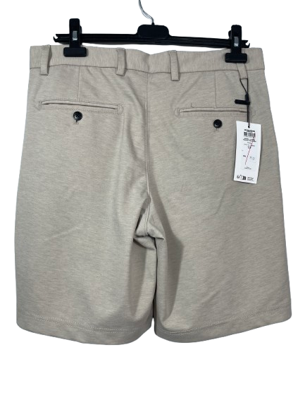 Back view of Men's Jack & Jones beige shorts showing two buttoned rear pockets and retail tags.