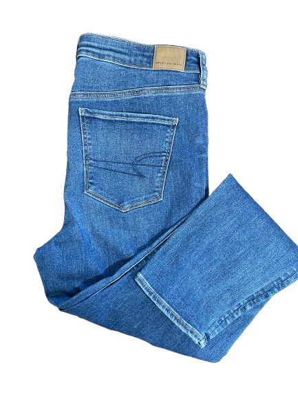 Folded blue jeans on a white background