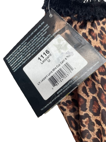 Leopard print fabric with a tag displaying product details.